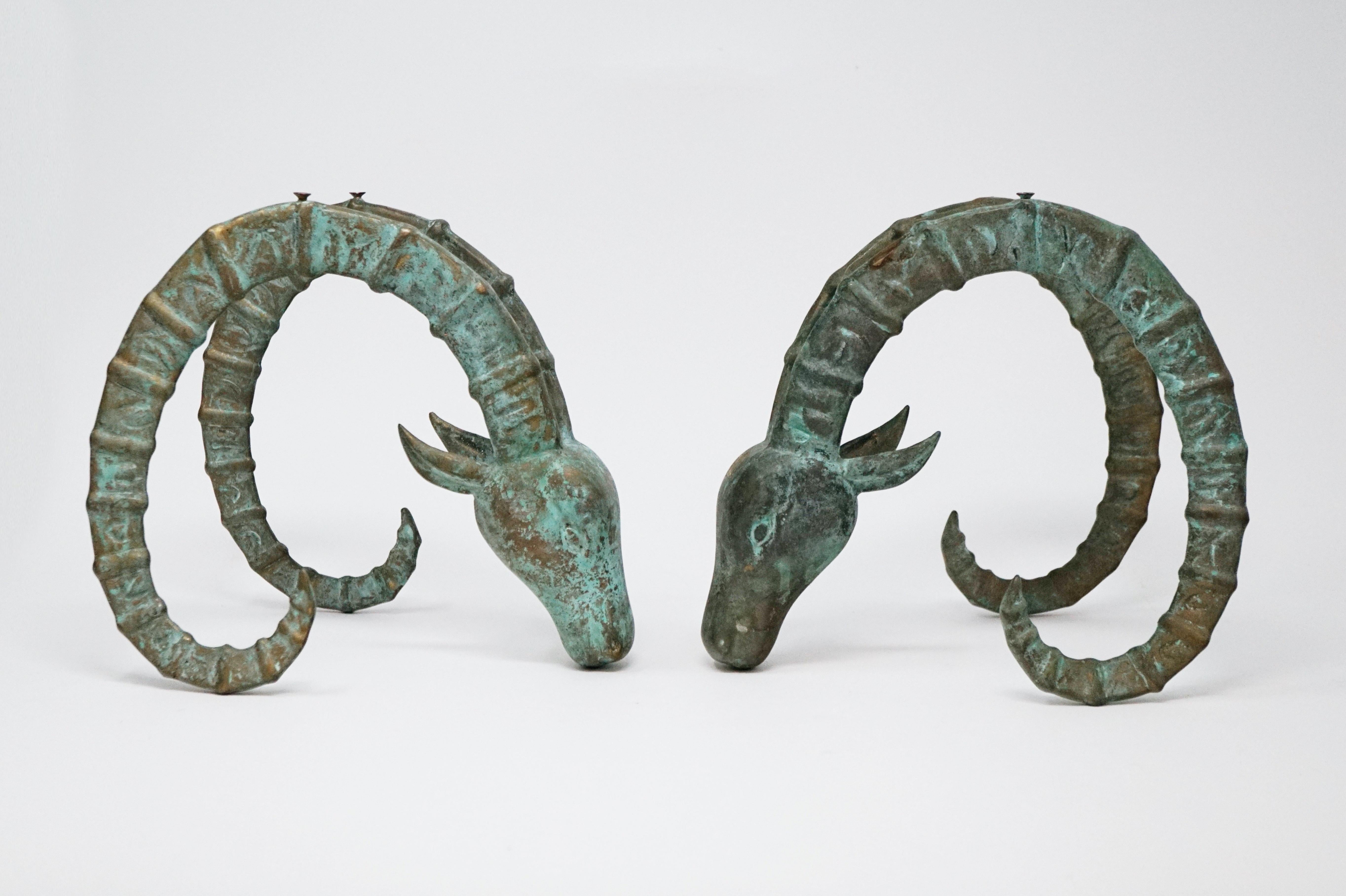 Set of two vintage bronze Ibex Ram's head sculptural figures in the manner of Alain Chervet, circa 1970s.

A beautiful natural patina covers these unique decorative objects, which can be used as bookends, accent pieces, or even crafted into a