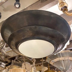 Paire de luminaires en bronze patiné, vendus à l'unité