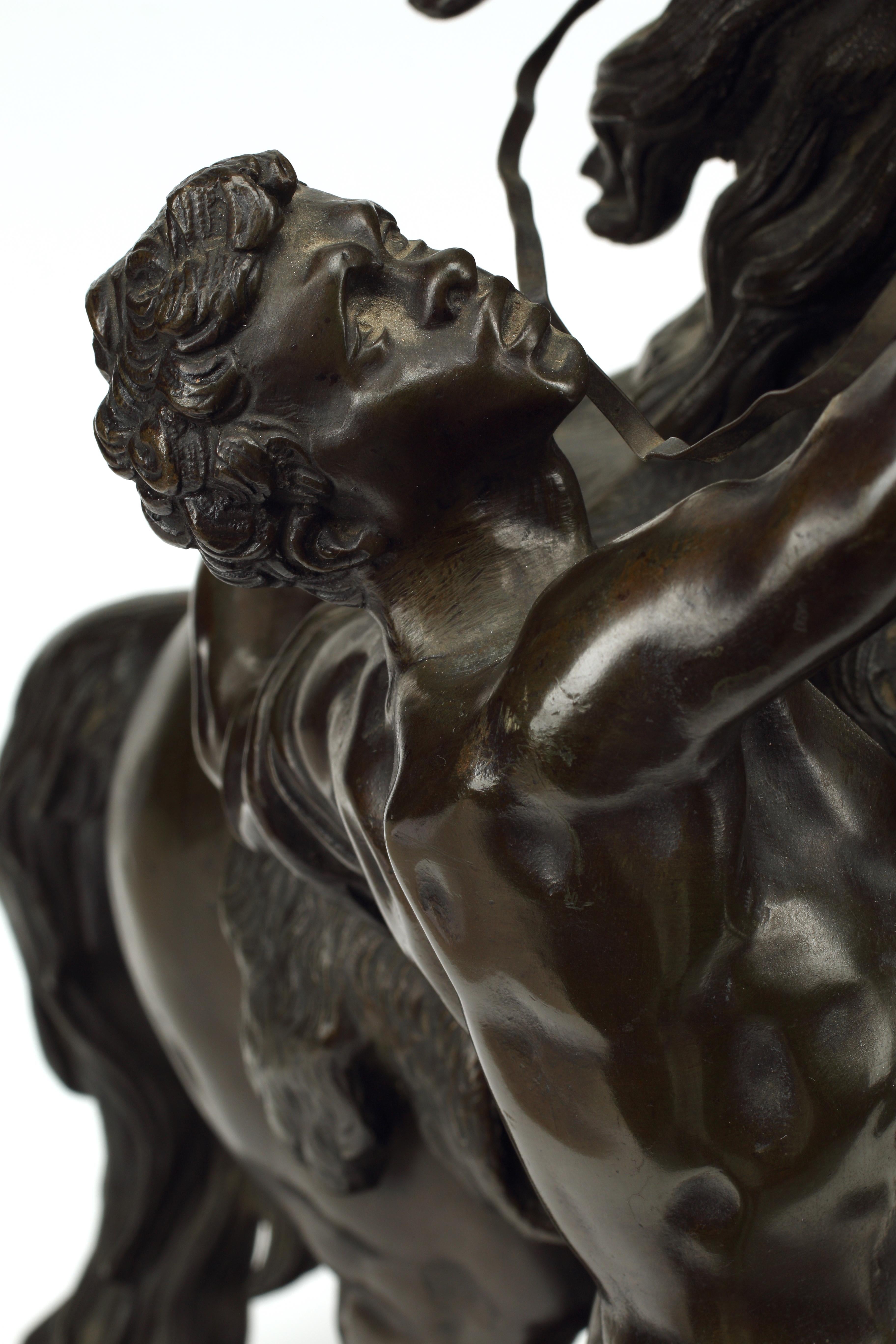 A pair of 19th century patinated bronze sculptures following the renowned 