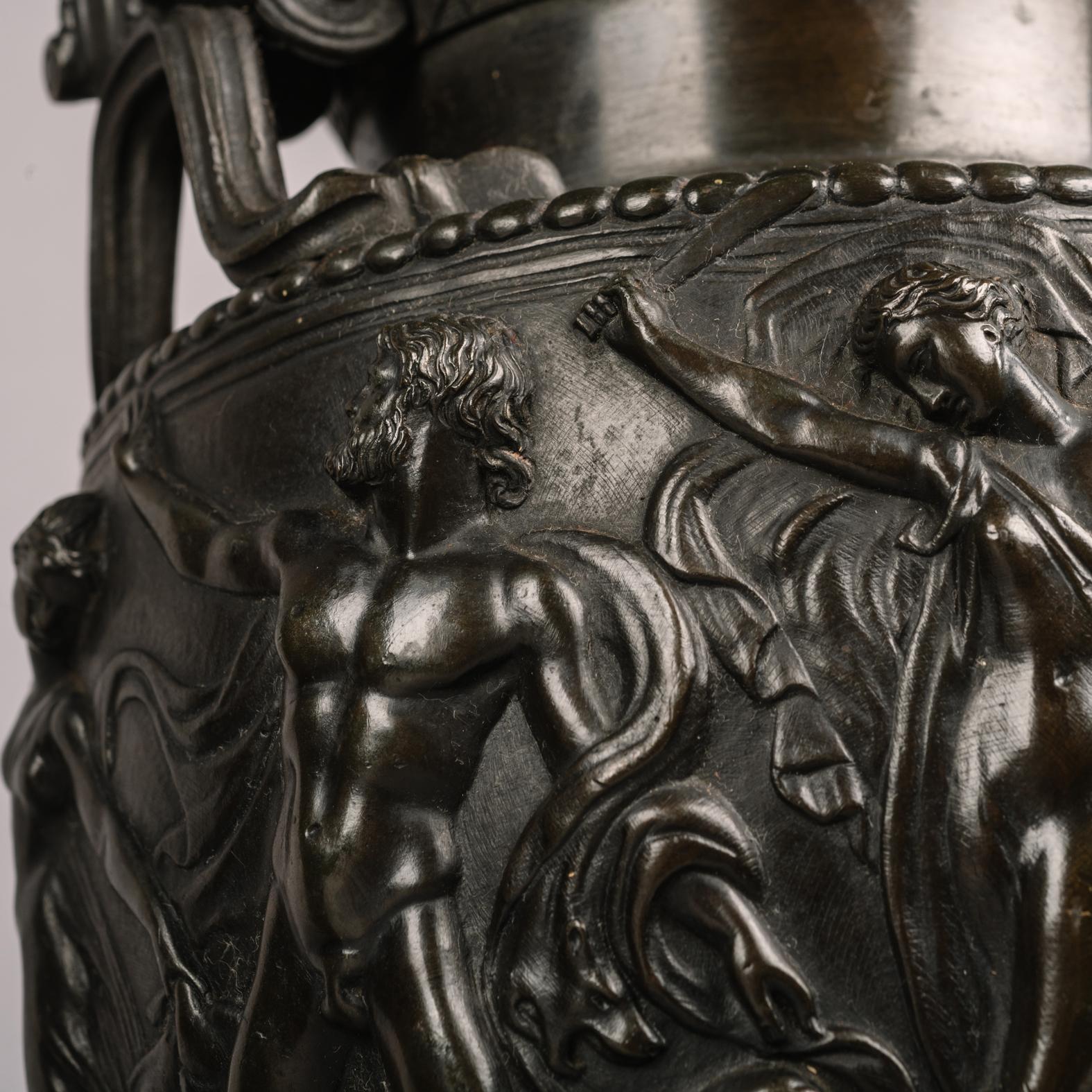 A fine pair of patinated bronze models of the townley vase, cast after the antique, by Auguste-Maximilien Delafontaine.

The bronze stamped to the underside ‘AD’ for Auguste-Maximillian Delafontaine. 

Each vase is of krater form with elaborate