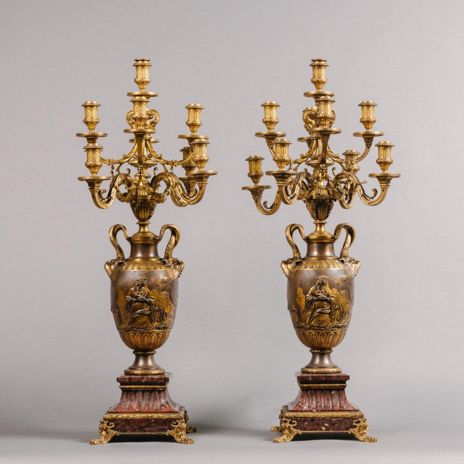 A fine pair of neoclassical style gilt and patinated bronze nine-light candelabra by Ferdinand Barbedienne,
French, Circa 1870.