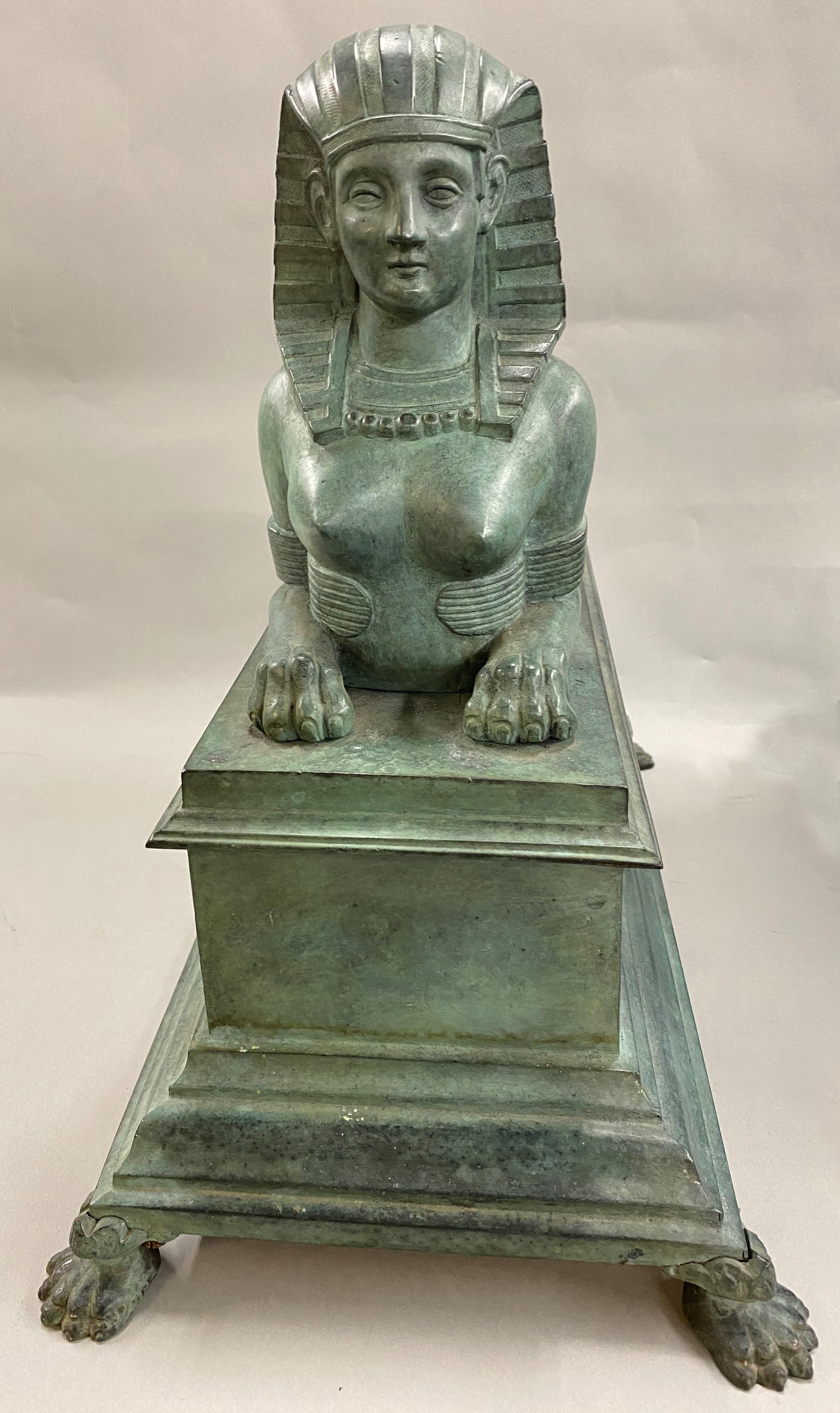 A fine quality pair of cast bronze Egyptian Revival sphinx on paw-foot bases, patinated in a green verdigris finish. Probably English in origin, circa 1900. Beautiful accent pieces for any living space. Very good overall condition, with minor