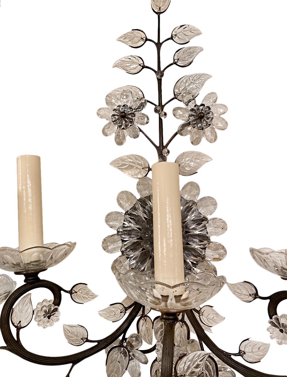 A pair of circa 1940's French sconces with molded glass leaves and flowers.

Measurements:
Height: 22.25
