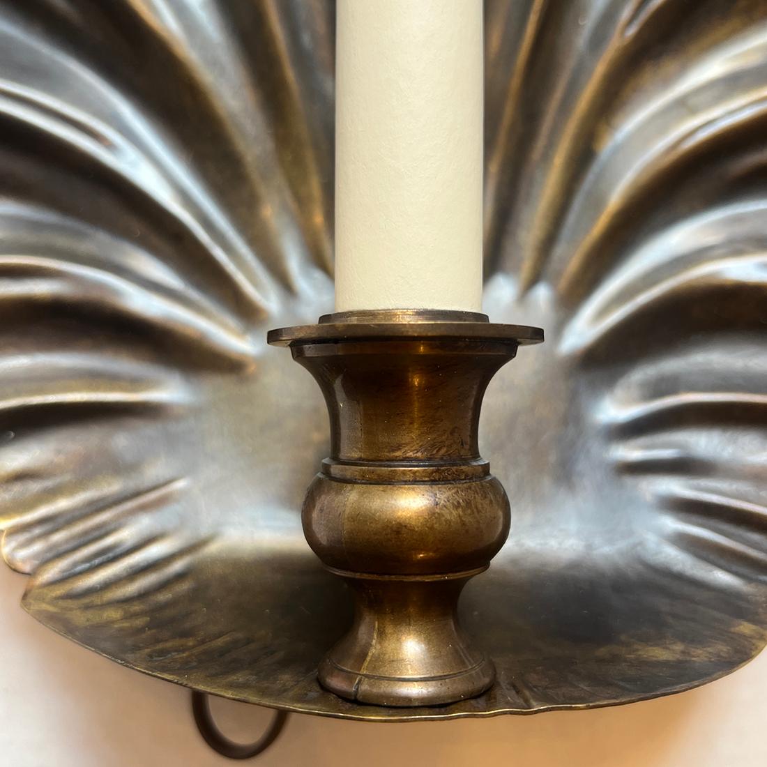 Pair of circa 1950's English patinated bronze shell sconces.

Measurements:
Height: 14