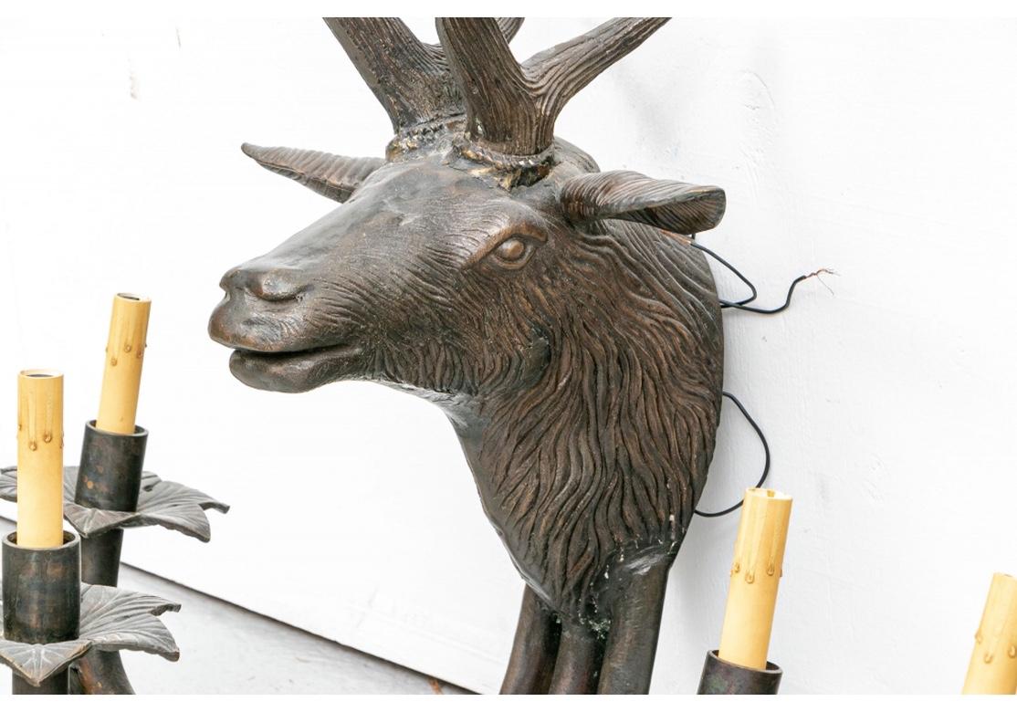 Cast Pair of Patinated Bronze Stag Head Sconces in Black Forest Style