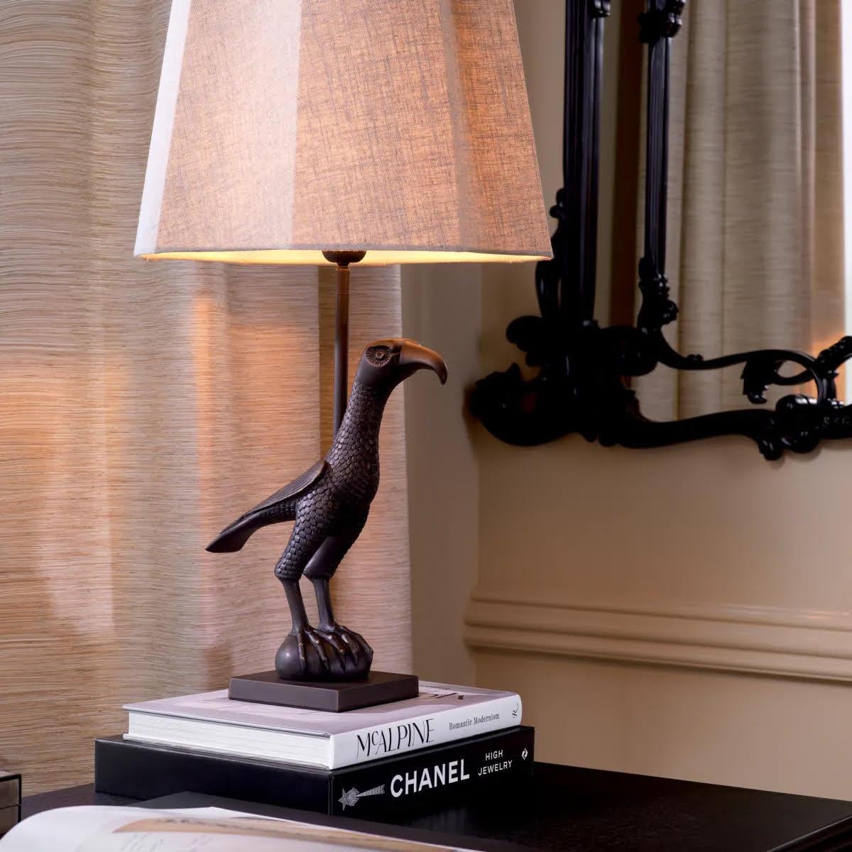 French Pair of Patinated Bronze Table Lamps Representing a Falcon. For Sale