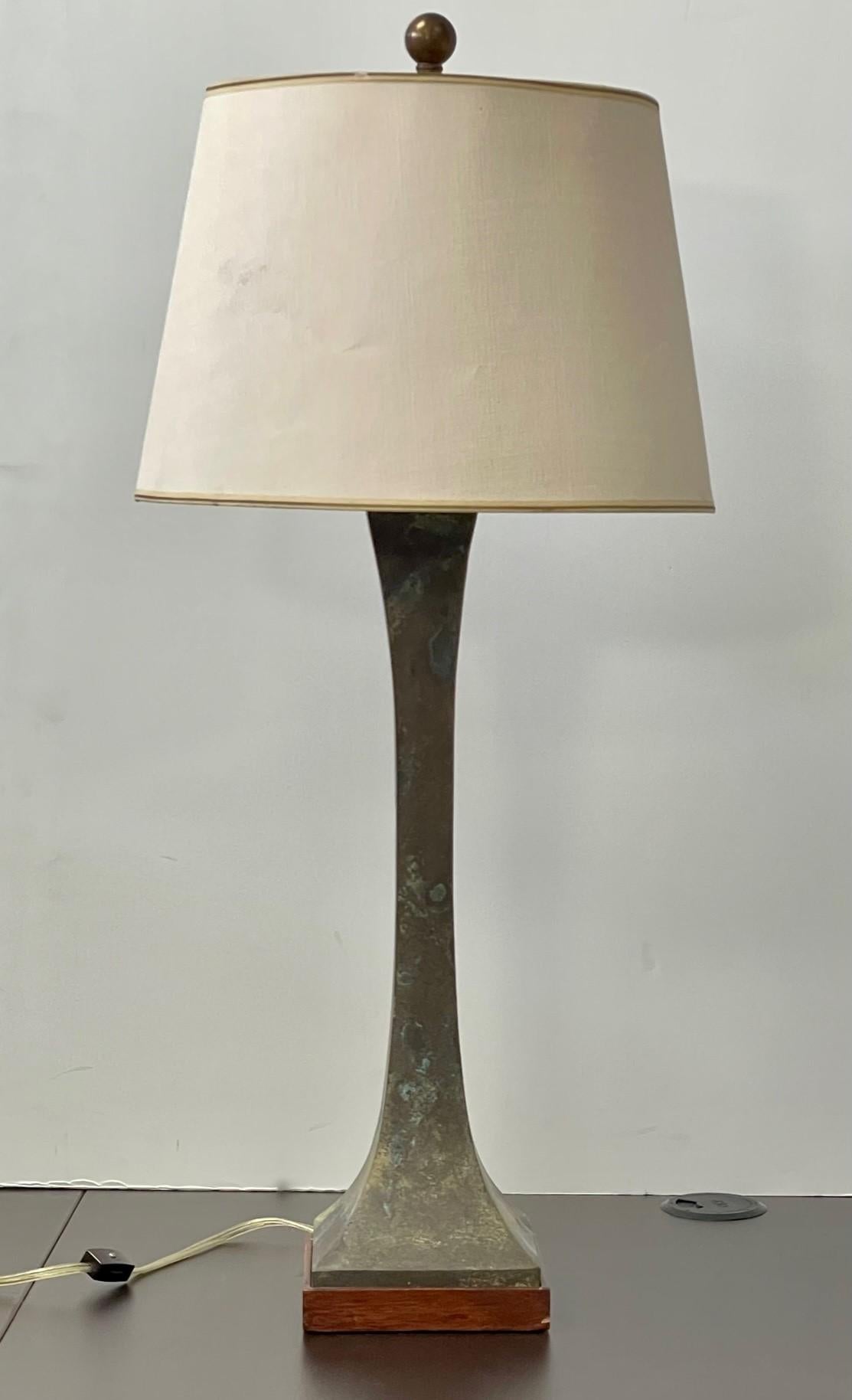 Sculptural square hourglass-form bronze table lamps designed by Stewart Ross James for Hansen Lighting. Sold as a set of 2. The uniquely patinated bronze bases present with a richly varied patina with hues of brown, tan, turquoise and white. On a