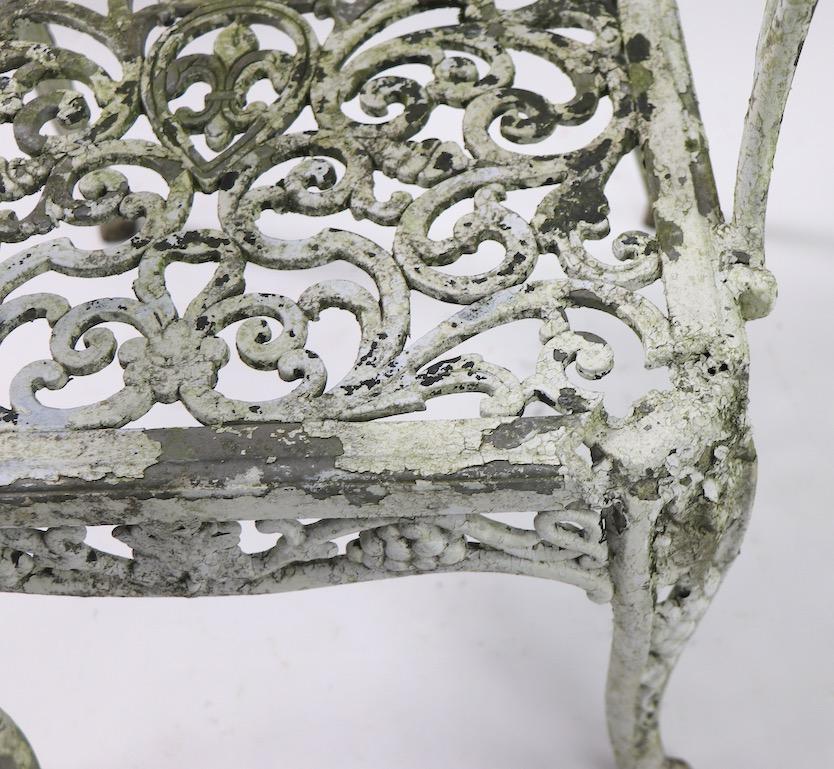 Pair of Patinated Cast Metal Garden Chairs In Fair Condition In New York, NY