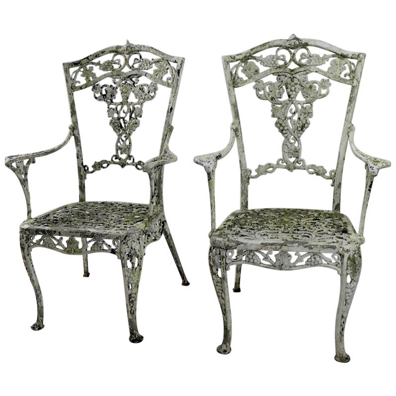 Pair of Patinated Cast Metal Garden Chairs