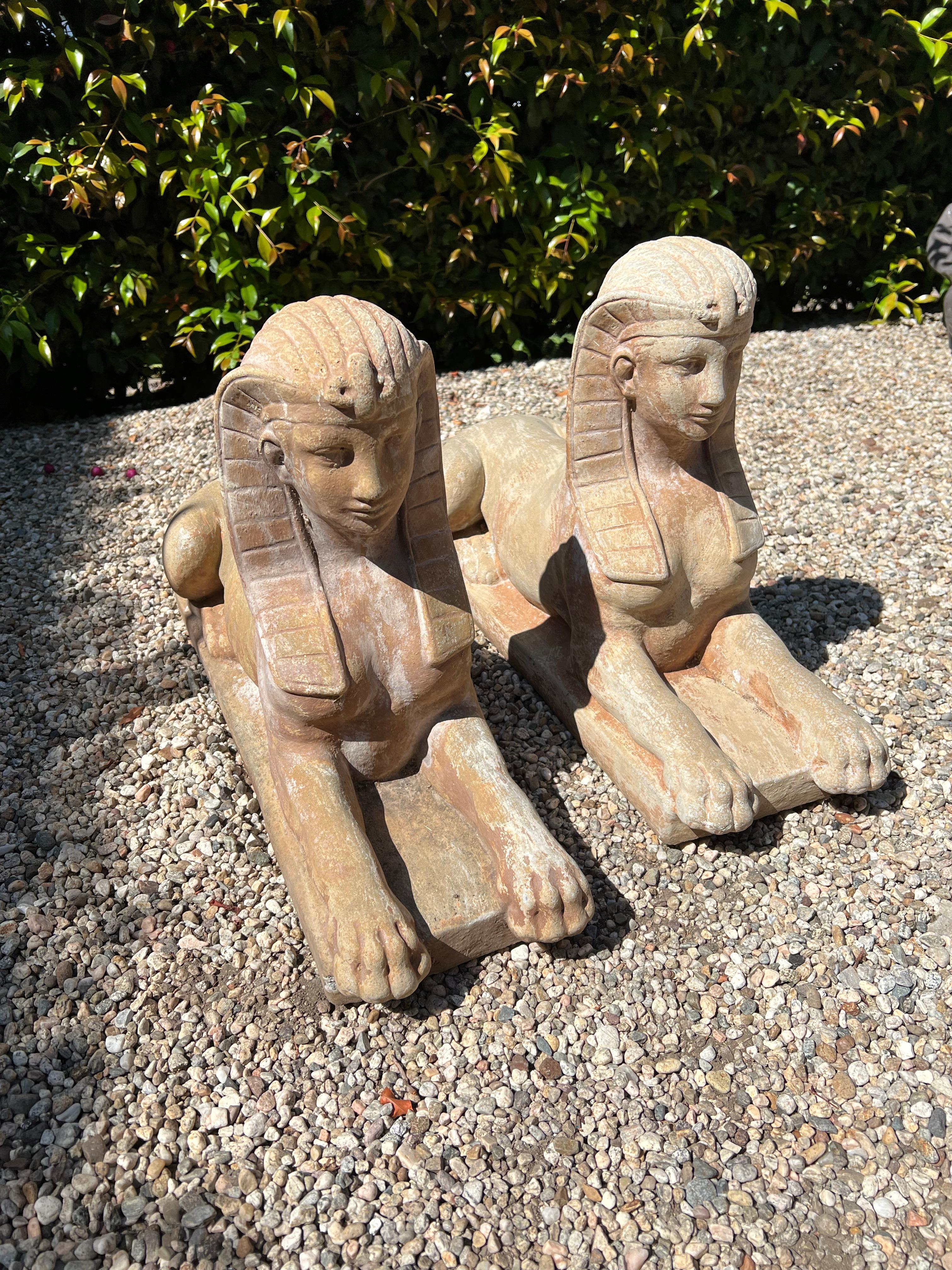 20th Century Pair of Patinated Cast Stone Sphinx Garden Sculptures