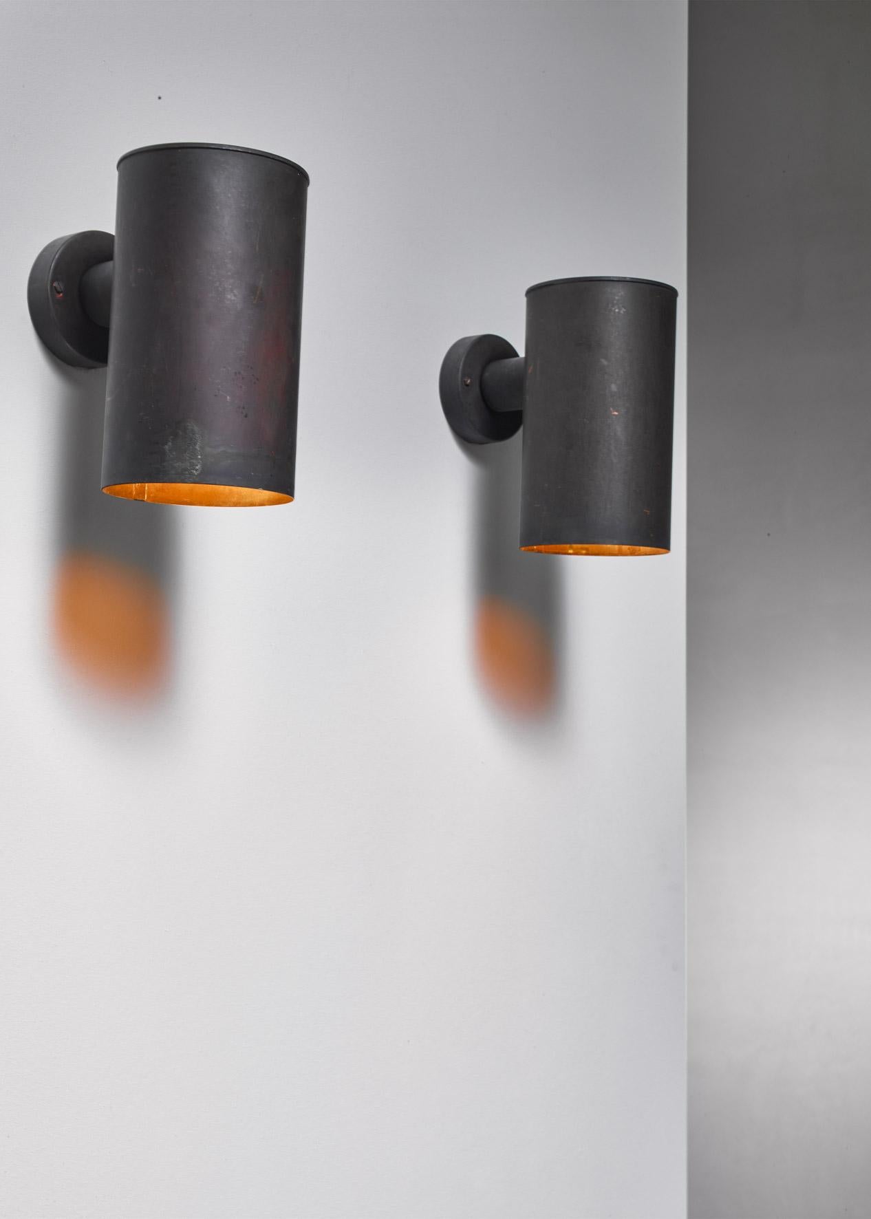 A pair of cylindrical sconces by Fagerhults, Sweden.

They are made of copper with a beautiful and very heavy patina.