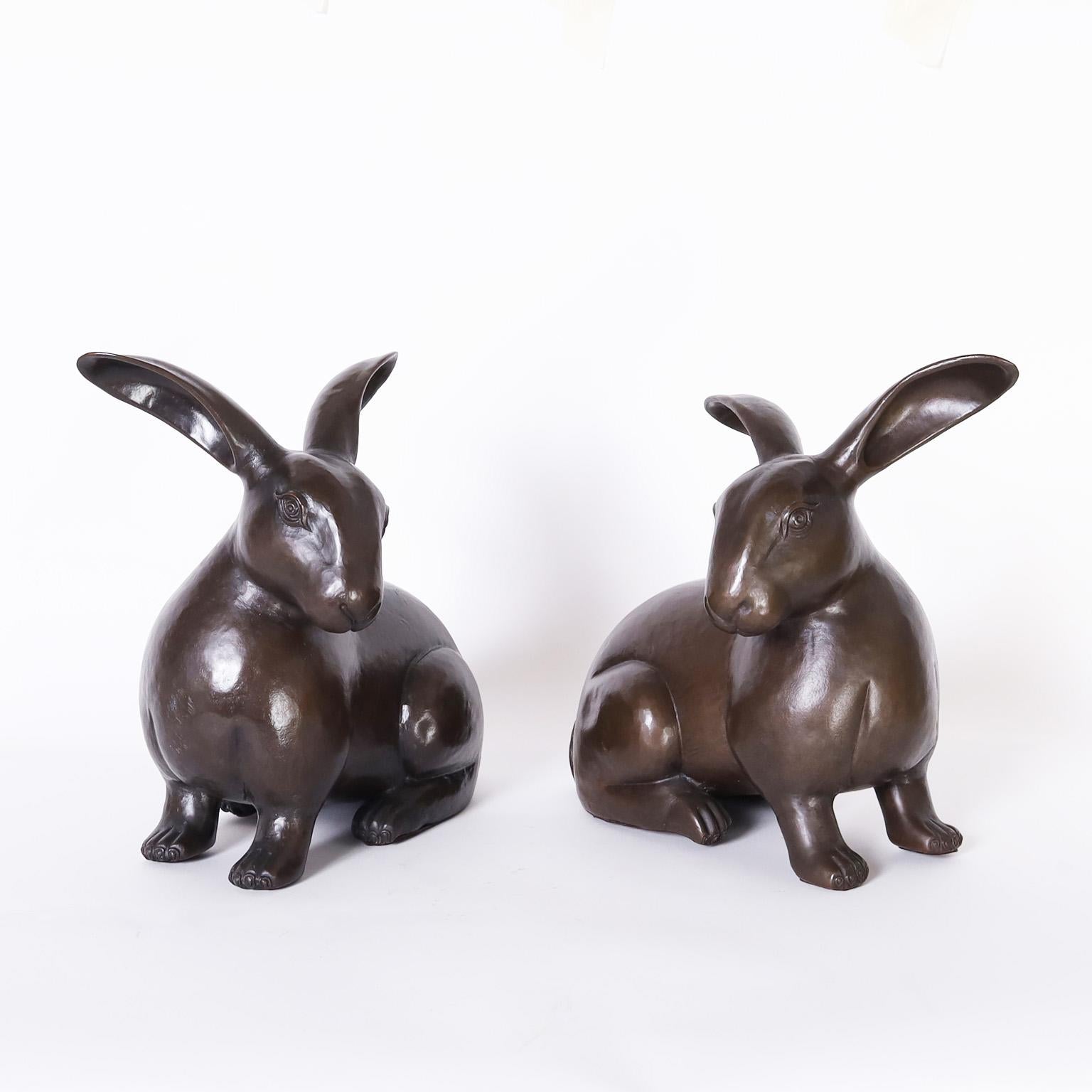 Pair of bunnies or rabbits hand crafted in copper and having a bronze like patina indistinctly signed on a leg.
