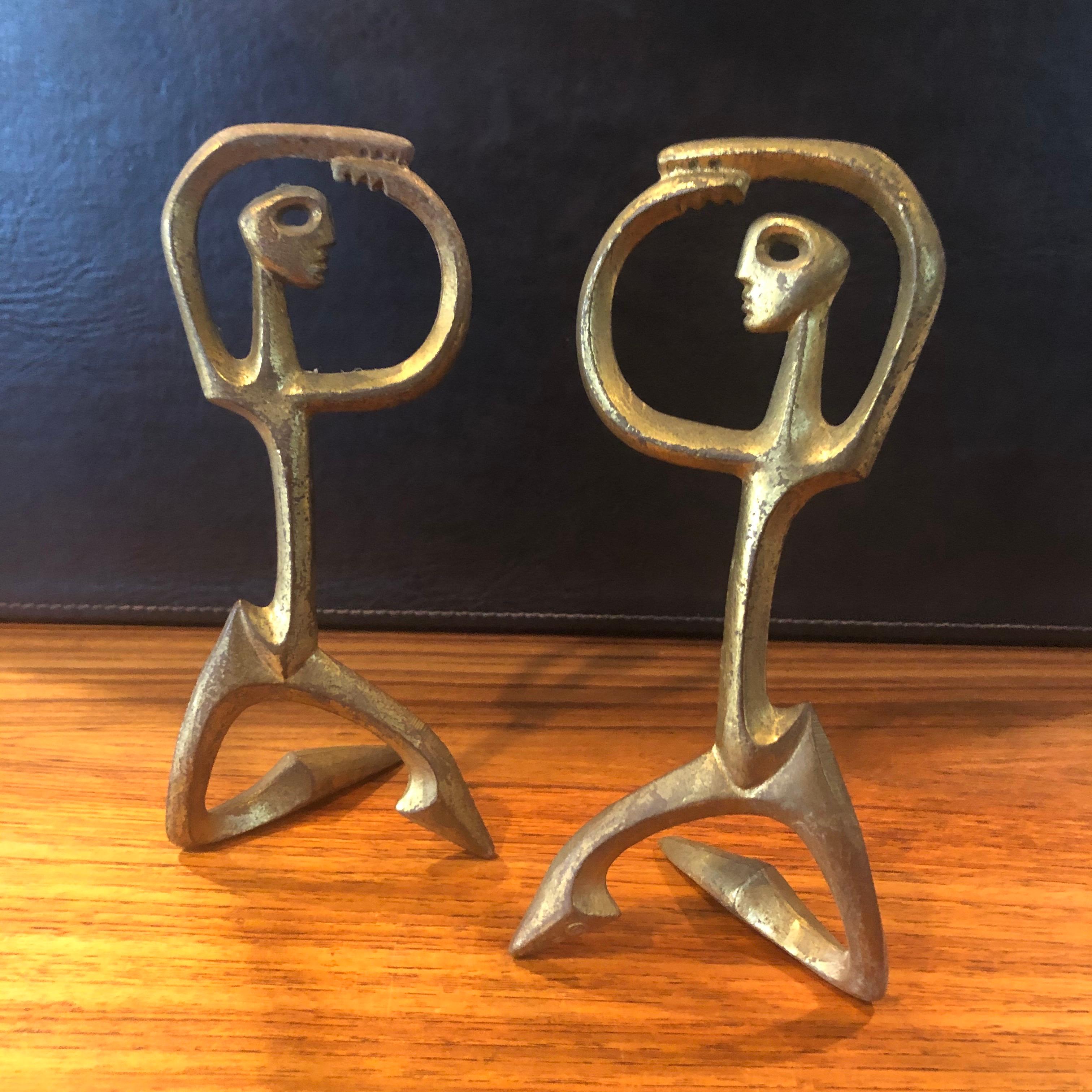 Pair of simple and elegant figurative patinated bronze sculptures by Frederic Weinberg, circa 1950s. The Minimalist and modern complementing figures have a wonderful vintage patina and are signed 