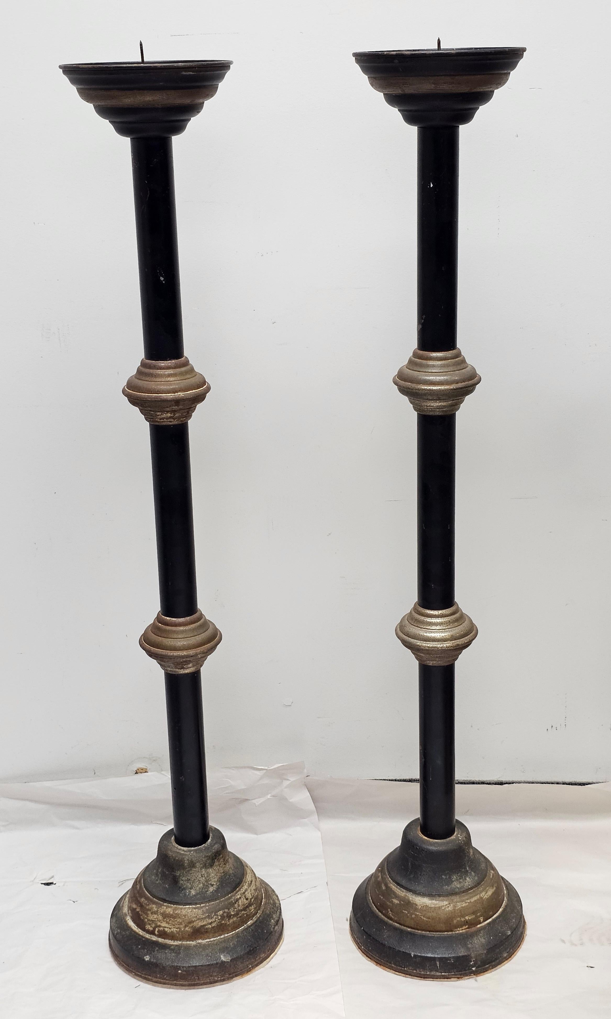 Pair of  Roman Style Patinated Iron and Ebonized Metal Prickets. Patinated cast iron base. Measure 9