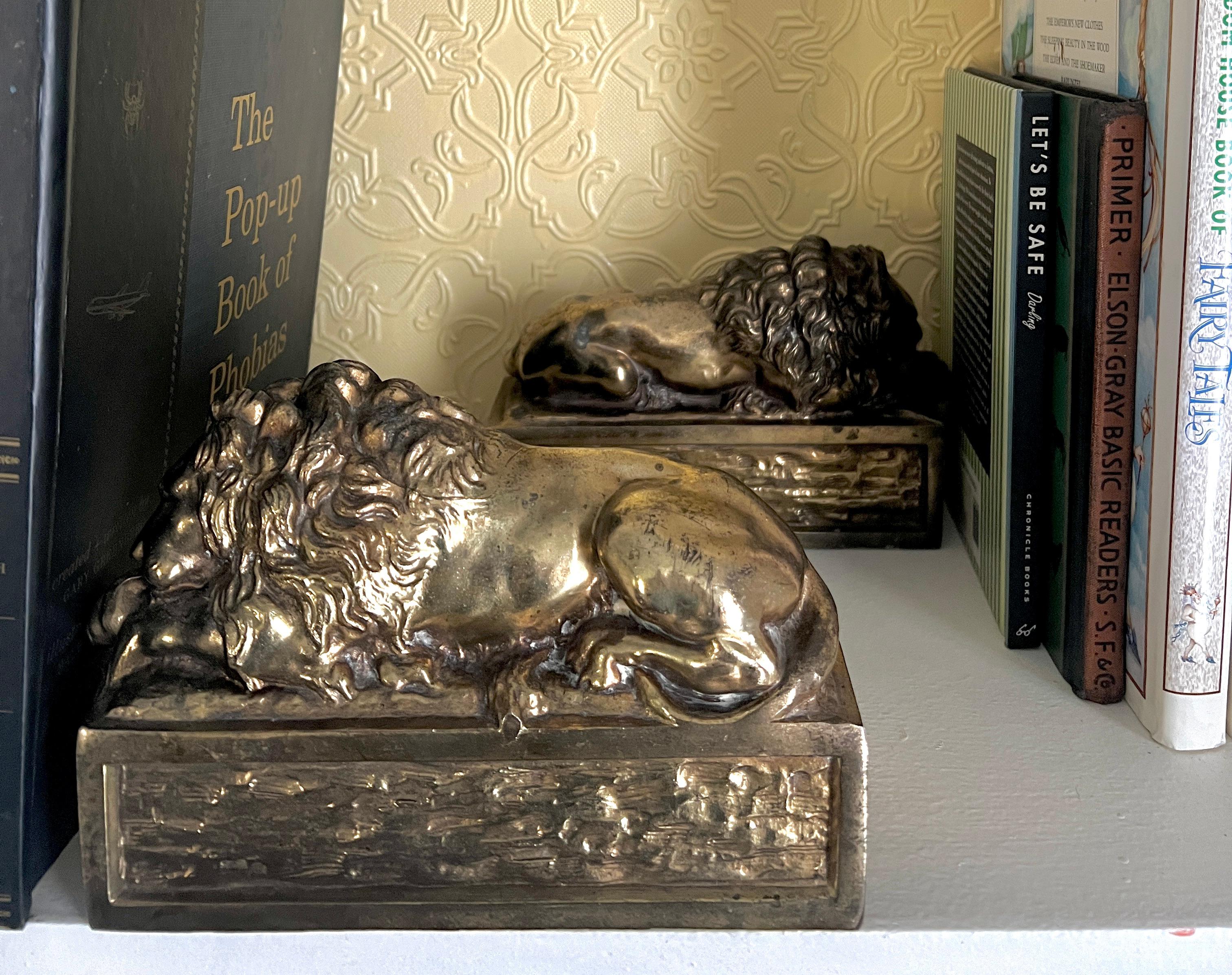 Pair of Patinated Italian Brass Reclining Lion Bookends In Good Condition In Los Angeles, CA