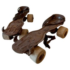 Pair of Patinated Metal and Wood Roller Skates