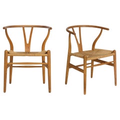 Used Pair of Patinated Oak “Wishbone” Arm Chairs by Hans Wegner circa 1960s