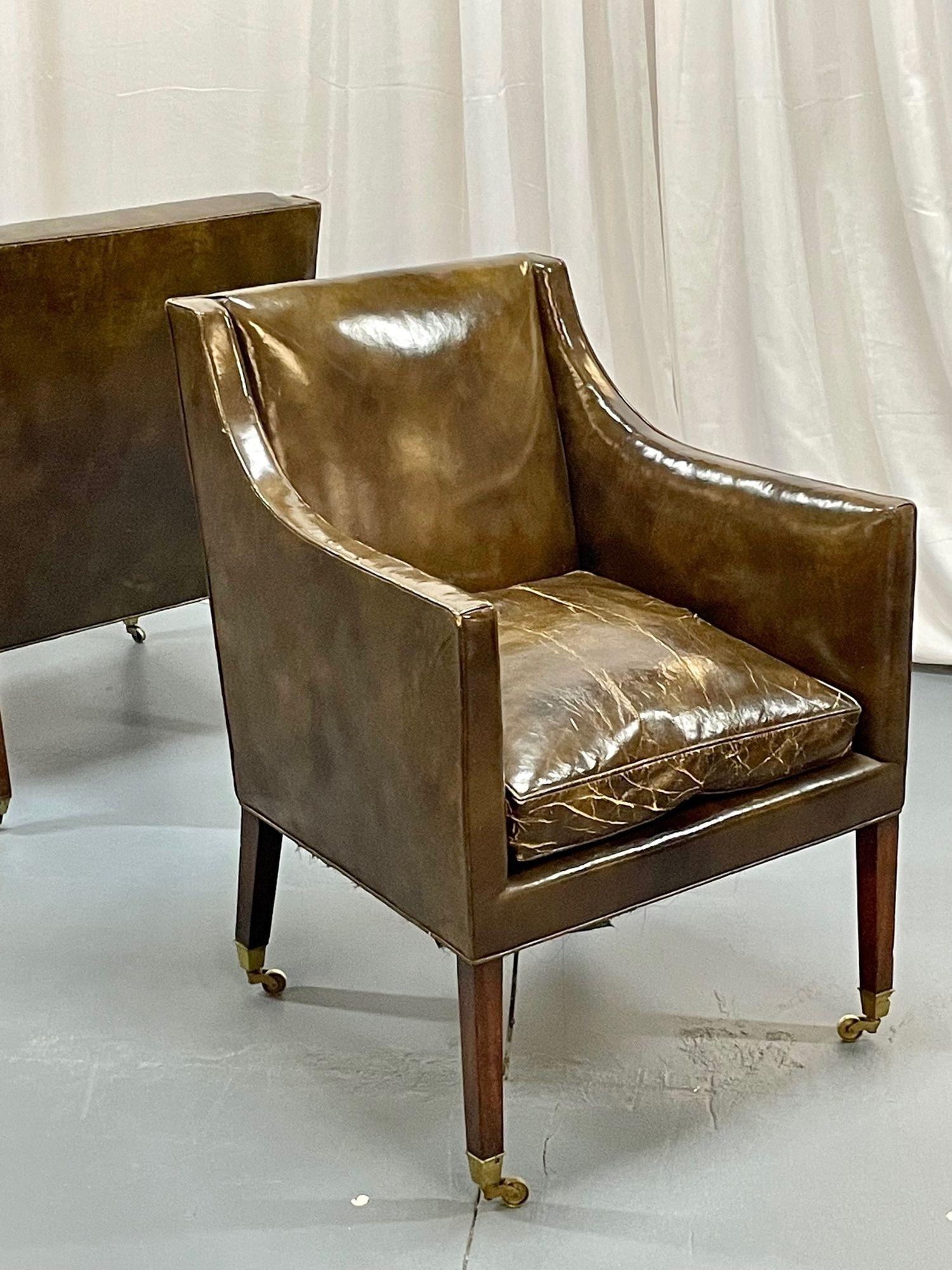 Pair of Patinated Regency Style Leather Upholstered Armchairs

Fantastic patina on this pair of regency library armchairs which still maintain their original leather upholstery. The leather seat cushions are removable. Each chair sits on four legs
