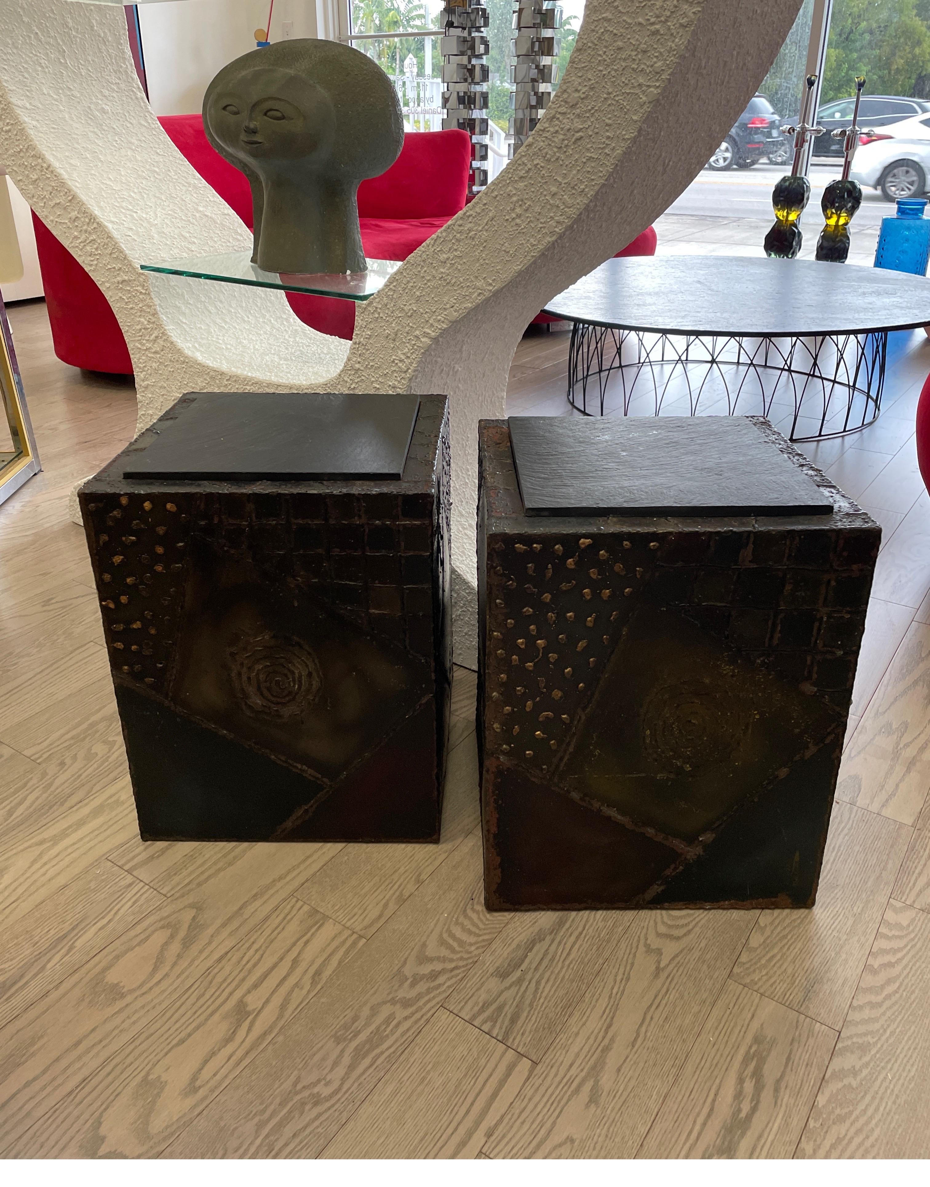 A pair of sculptural side tables in the Brutalist style by Paul Evans. These tables are both signed and dated 1971. An iconic design.