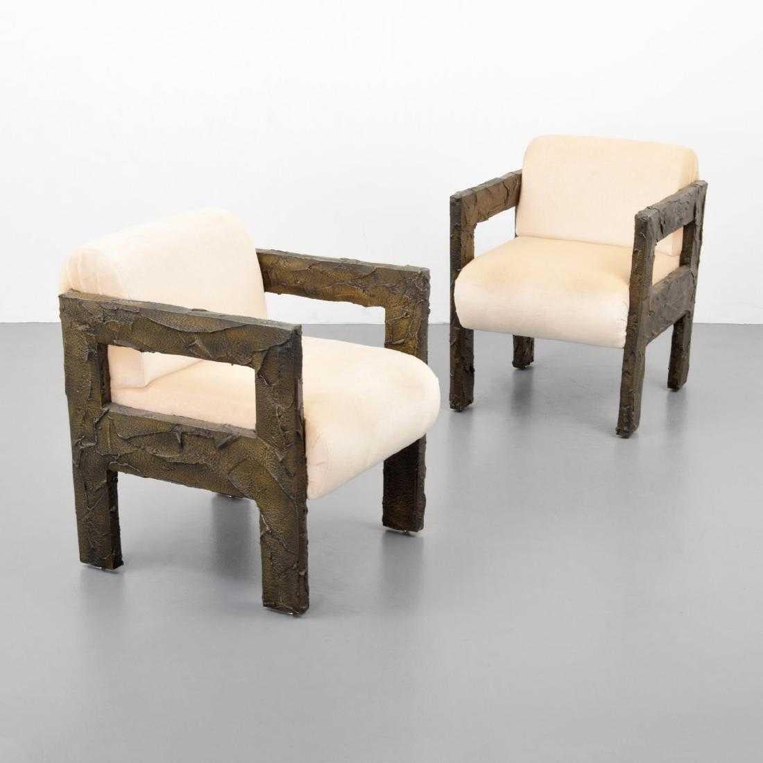 Pair of sculpted bronze lounge chairs by Paul Evans for Paul Evans Studio. Chairs are accompanied by a Letter of Provenance issued by Dorsey Reading, dated 11.16.2018.

Materials: bronze resin, upholstery.
 