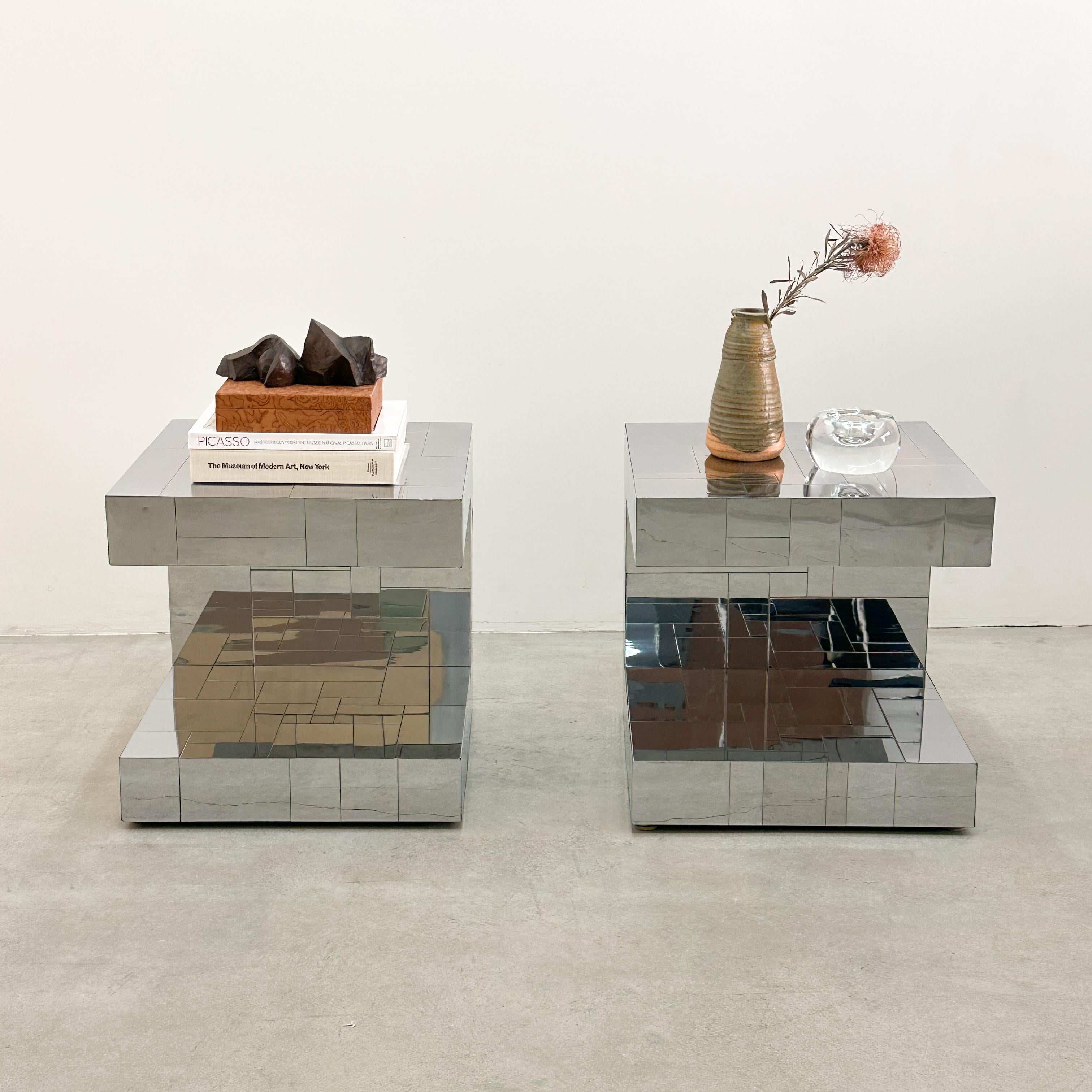 A pair of signed Paul Evans Cityscape end tables are also great as nightstands.

Color: Chrome

Measurements:
Length: 20