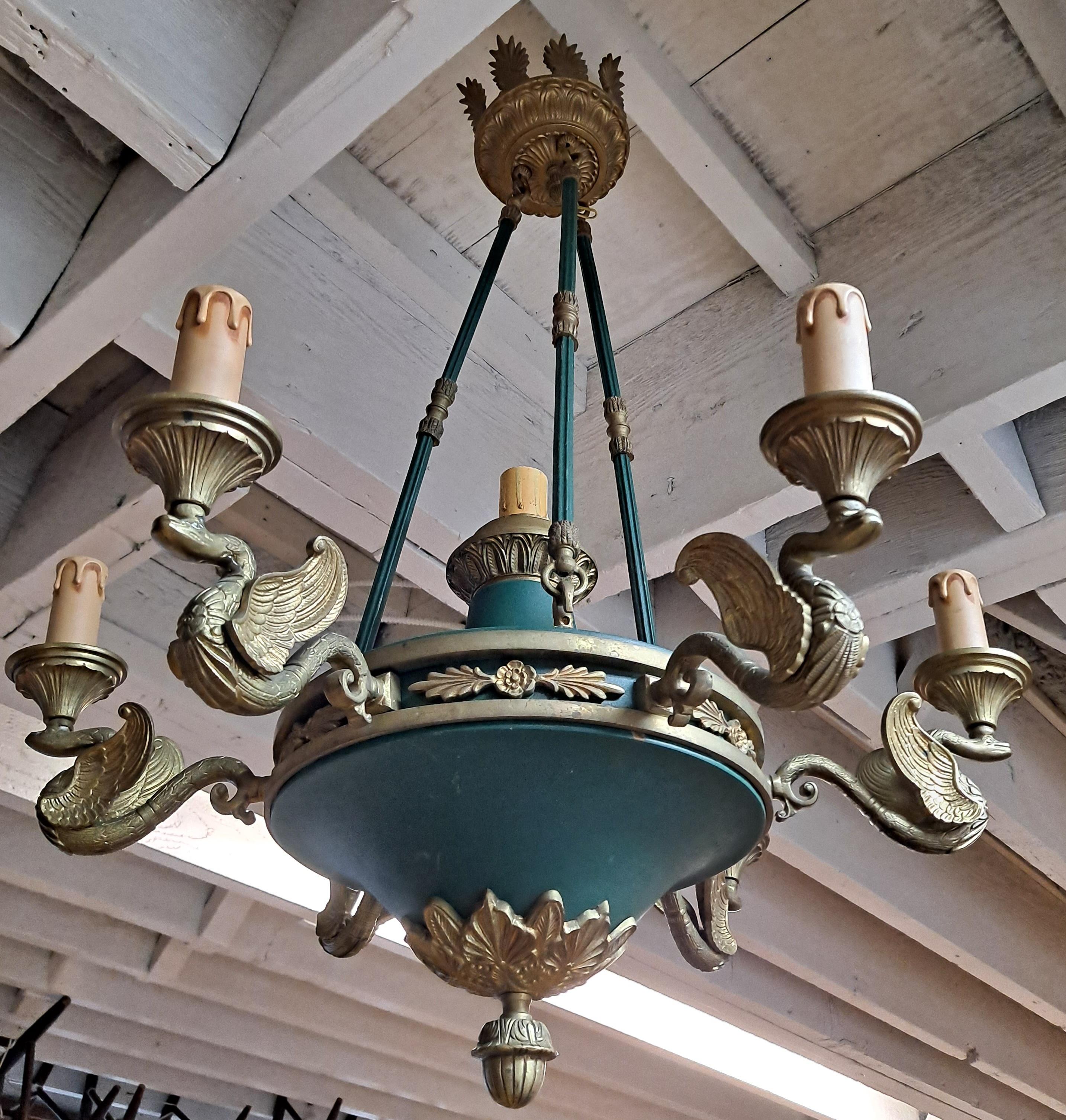 A wonderful pair of Paul Ferrante empire-style six-arm chandeliers with 7 bulb sockets 

Gold gilded & green painted bronze 

 25