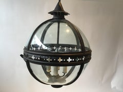 Pair of Paul Ferrante Iron and Glass Orb Chandeliers
