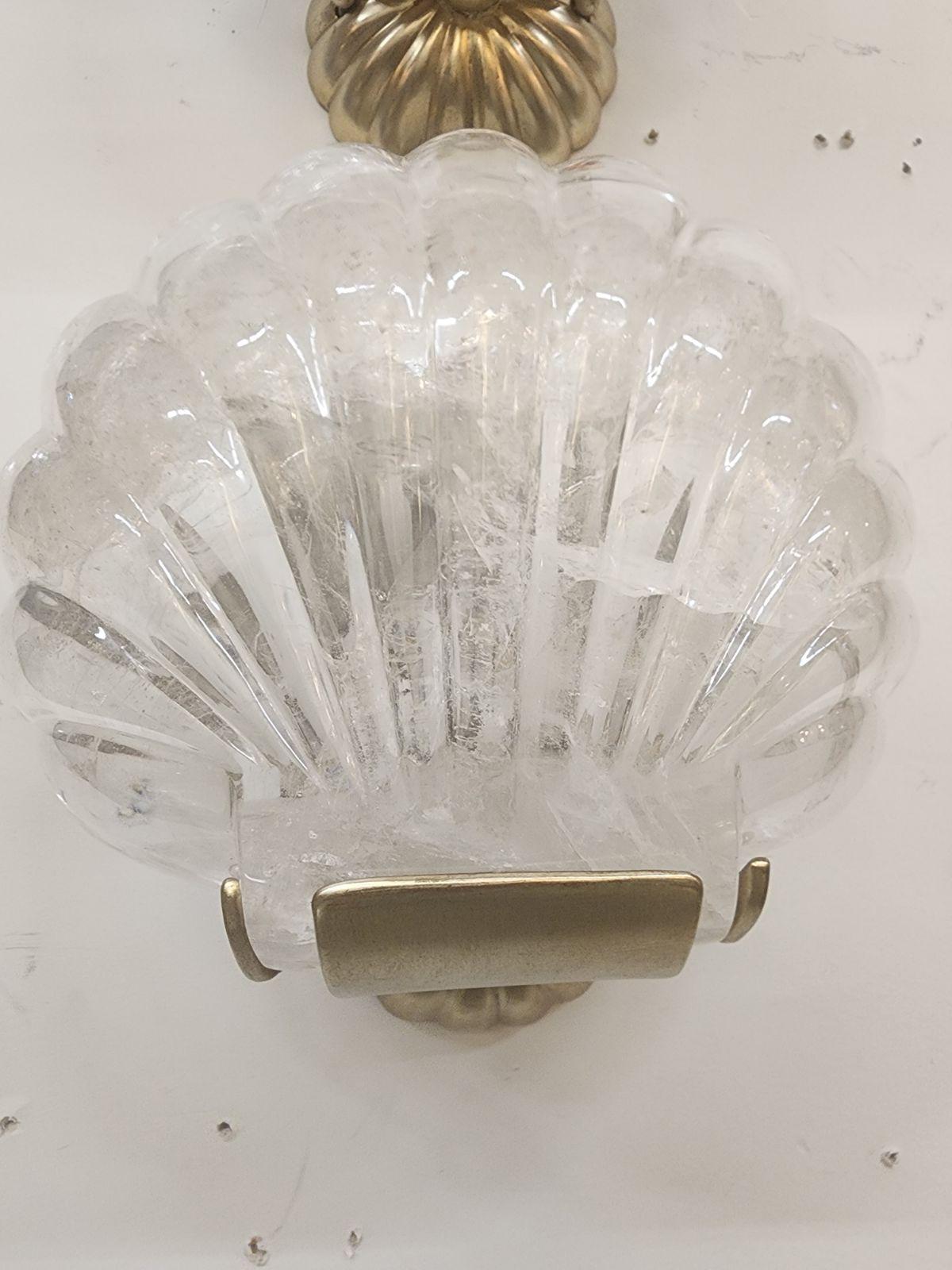 A beautiful pair of Paul Ferrante Carved rock Crystal and Silver Shell sconces. made in the 21st century. 