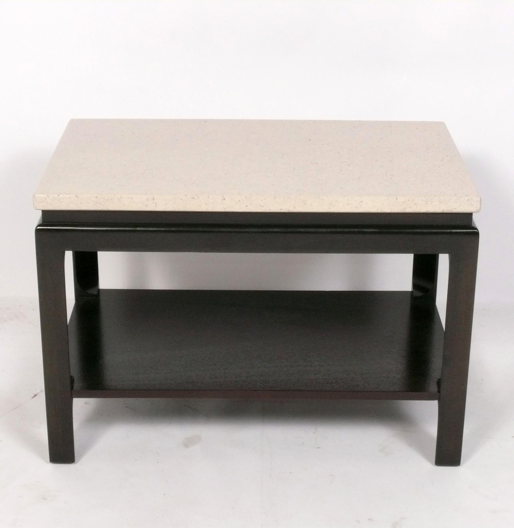 Pair of cork top end tables, designed by Paul Frankl for Johnson Furniture, American, circa 1940s. The clean lined form of these tables exhibit the Asian influences seen in many of Frankl's designs from this period. They have been refinished in
