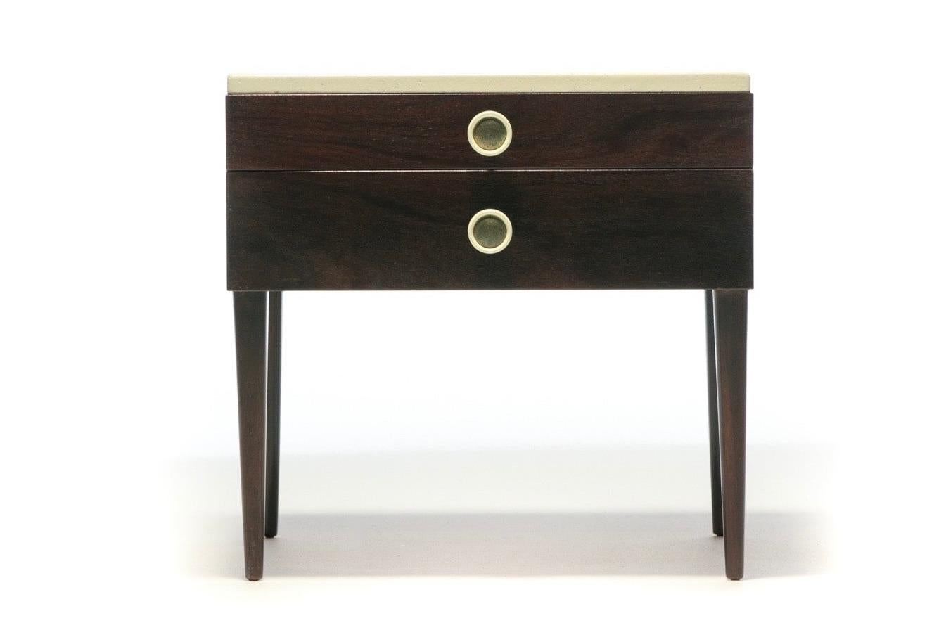 A Mid-Century Modern pair of Paul Frankl cork top mahogany nightstands or end tables professionally restored to their original finishes - dark walnut mahogany stain and ivory lacquered Cork tops - made by Johnson Furniture circa 1950. Original