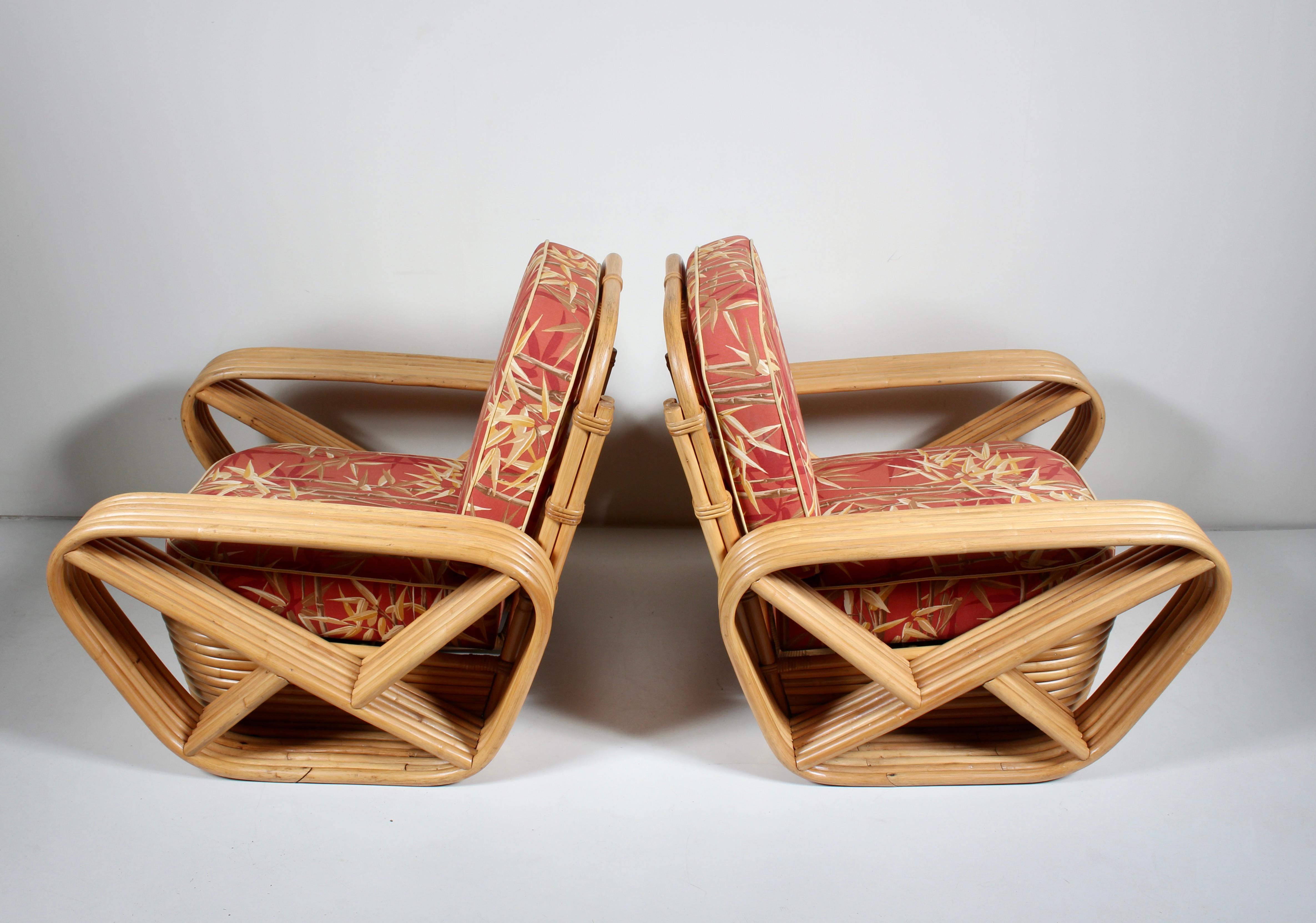 Pair of Tochiku Industry LTD for Paul Frankl Six Strand Bamboo and Rattan Lounge Chairs.  Featuring square steam bent stacked Bamboo strand frame, wrapped Rattan, wide seats, supported ergonomic back, six bands of Bamboo across on each arm rest, and