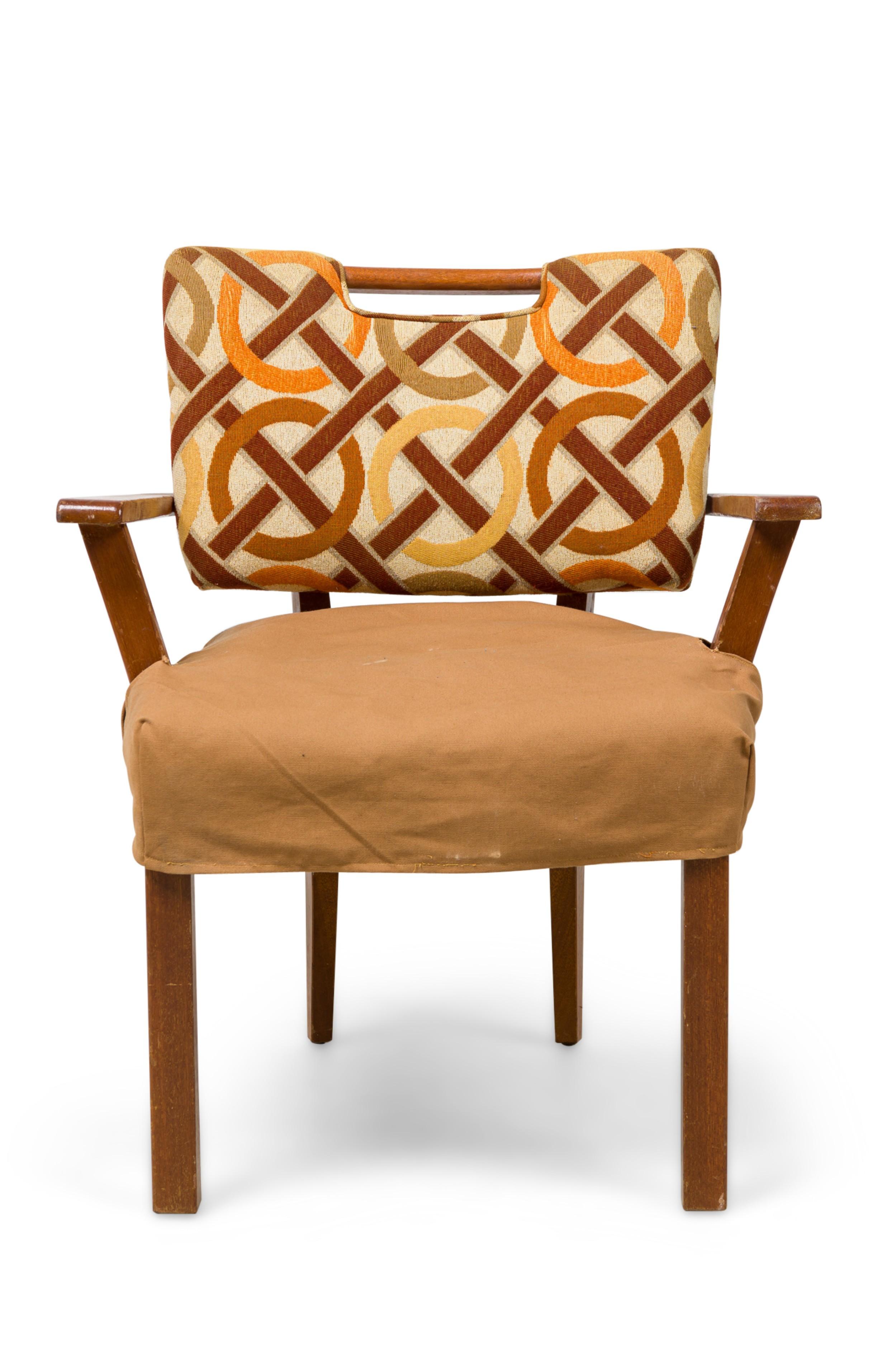PAIR of Mid-Century (1950s) American armchairs with flat right-angled arms, padded backs upholstered in a brown tone geometric patterned fabric, seat wrapped in light brown canvas fitted & buttoned covers, the back legs tapered and slightly splayed.
