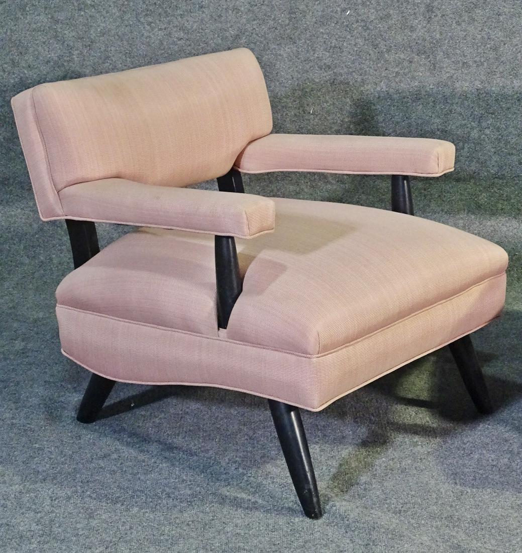 Pair of sleek Mid-Century Modern chairs featured in light upholstery and ebonized legs.

Please confirm item location (NY or NJ).