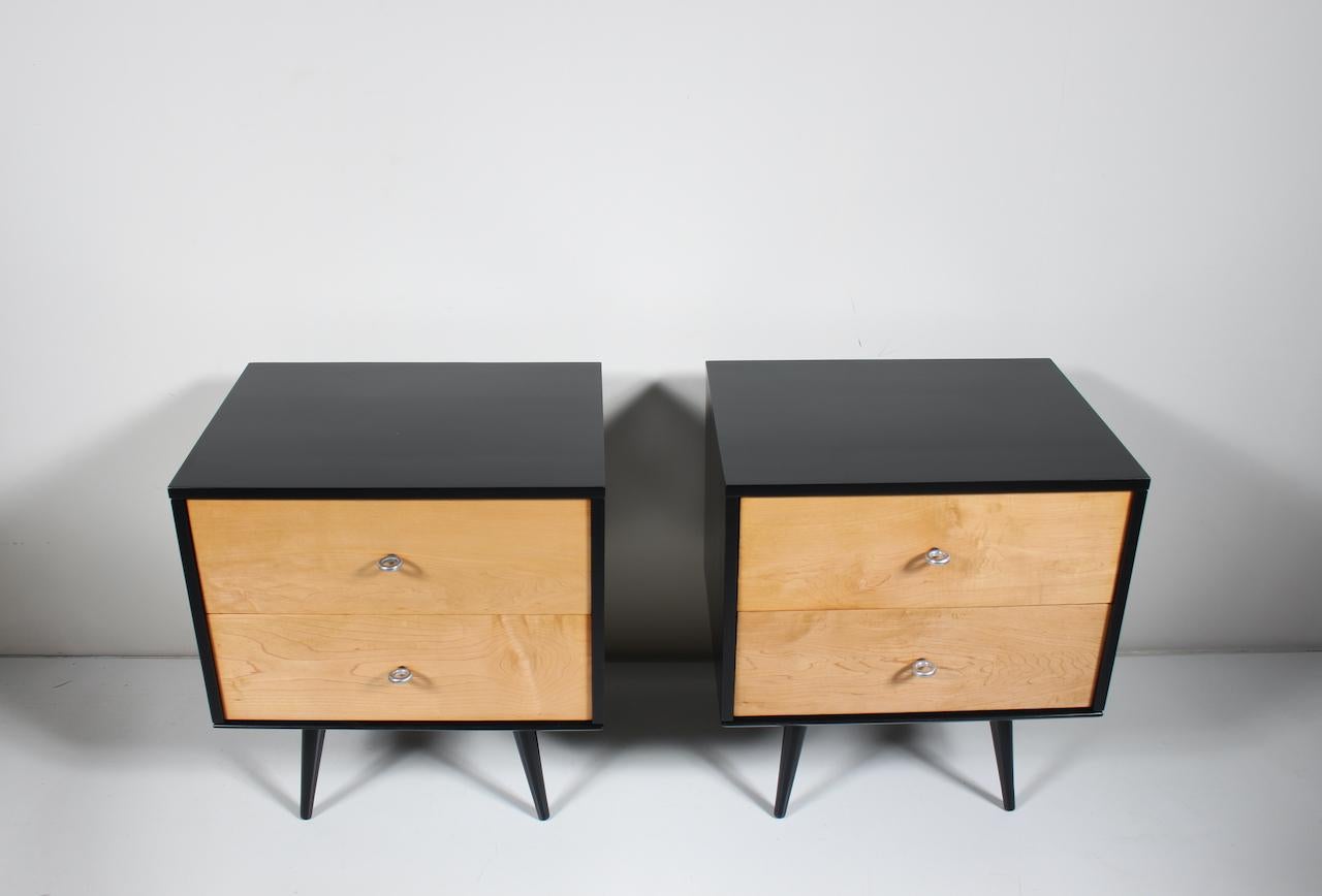 Pair of Paul McCobb Planner Group by Winchendon maple nightstands, cabinets, chests, end tables, 1950's. Featuring Model 1503  Black enameled wood exterior cabinets, two large natural finish Maple drawers, original larger polished Aluminum donut