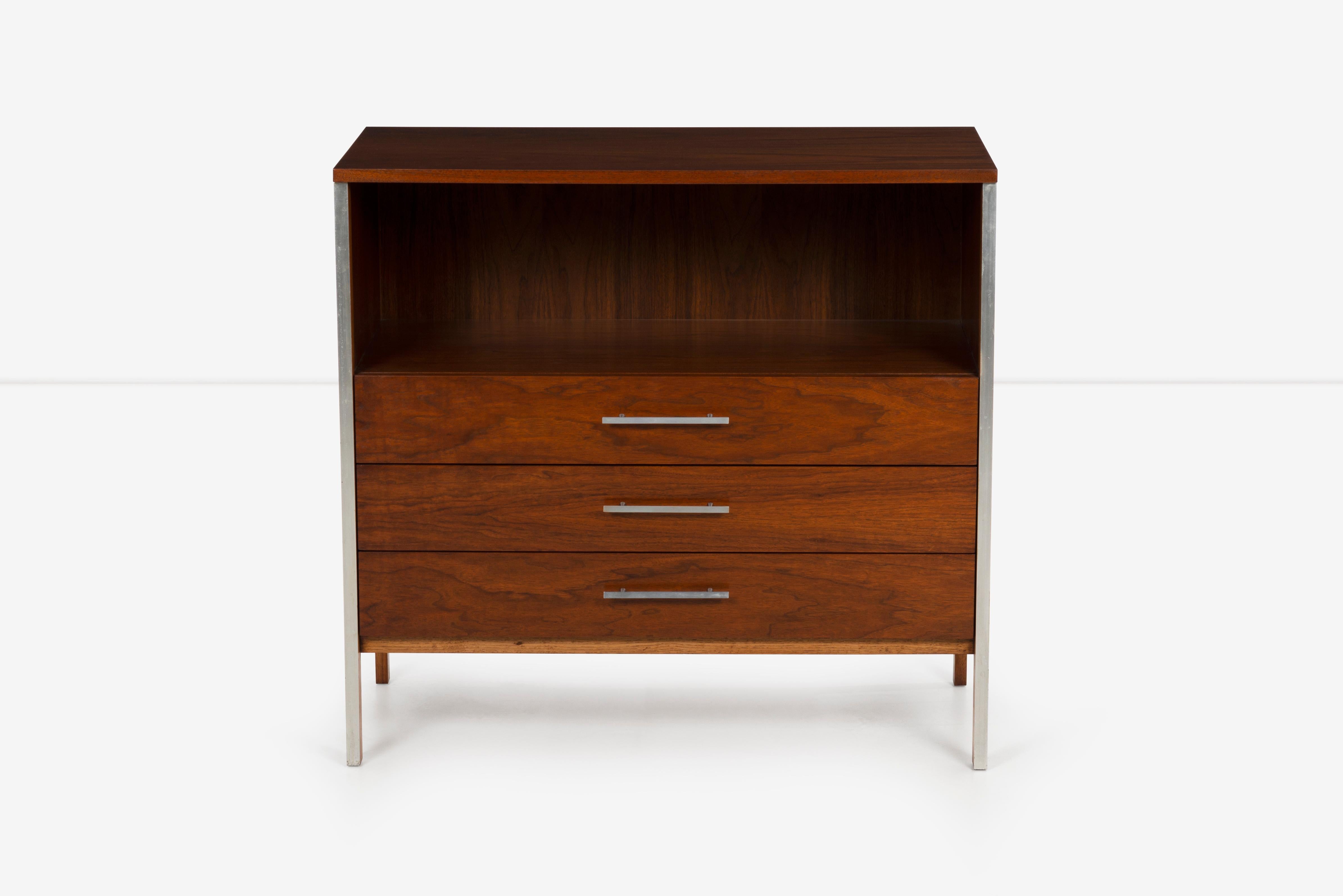 Pair of Paul McCobb for Calvin Dressers, the linear group, oiled walnut with stainless steel pulls and accent details.
One case has 4 drawers, the other has 3 with open storage.
Label on inside drawer.