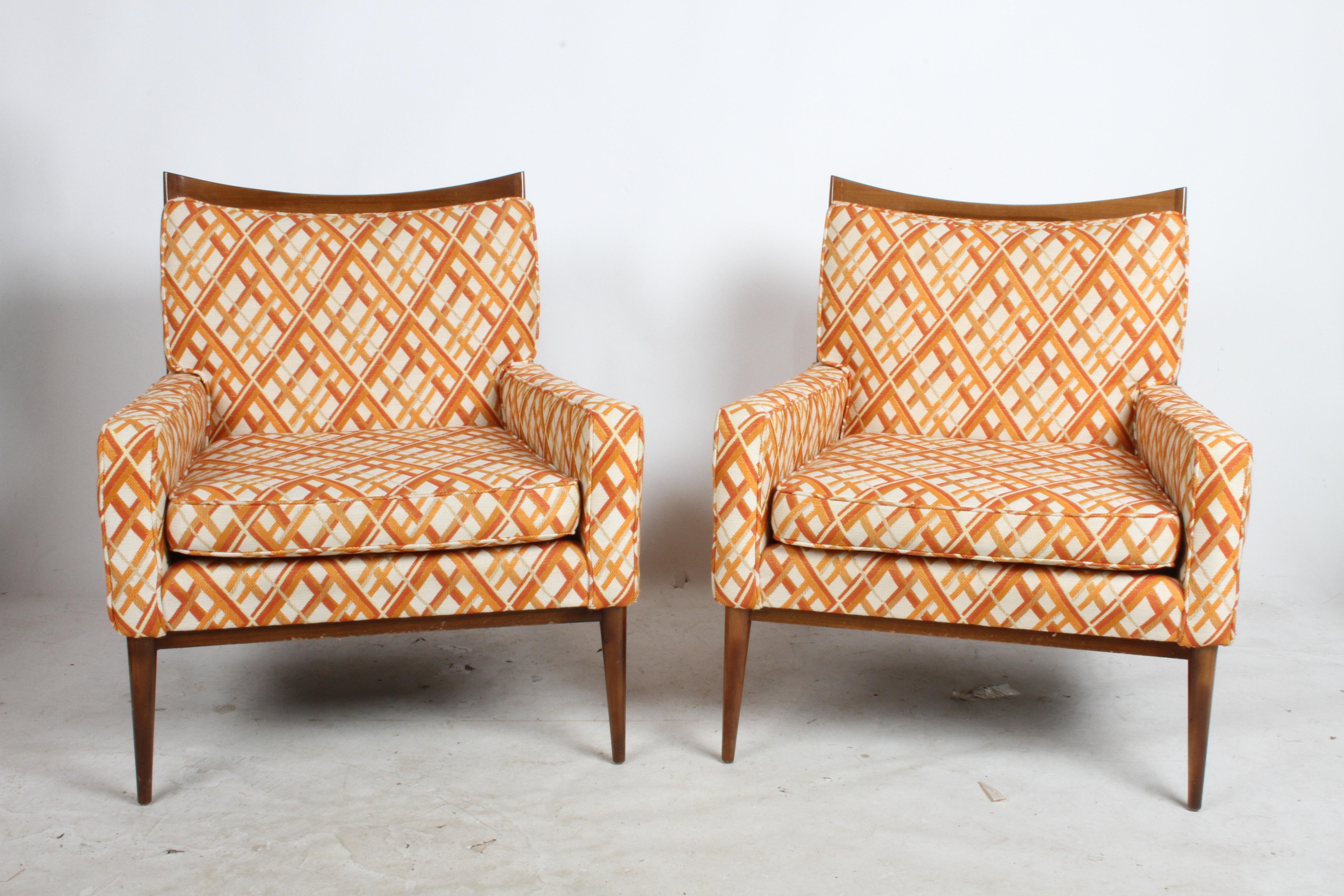 Pair of Paul McCobb for his Directional line model 1322 lounge chairs, shown with original fabric and finish. Finish to be restored prior to shipping, fabric is in incredible condition, some stiffness to foam on seat backs. Fresh from one owner