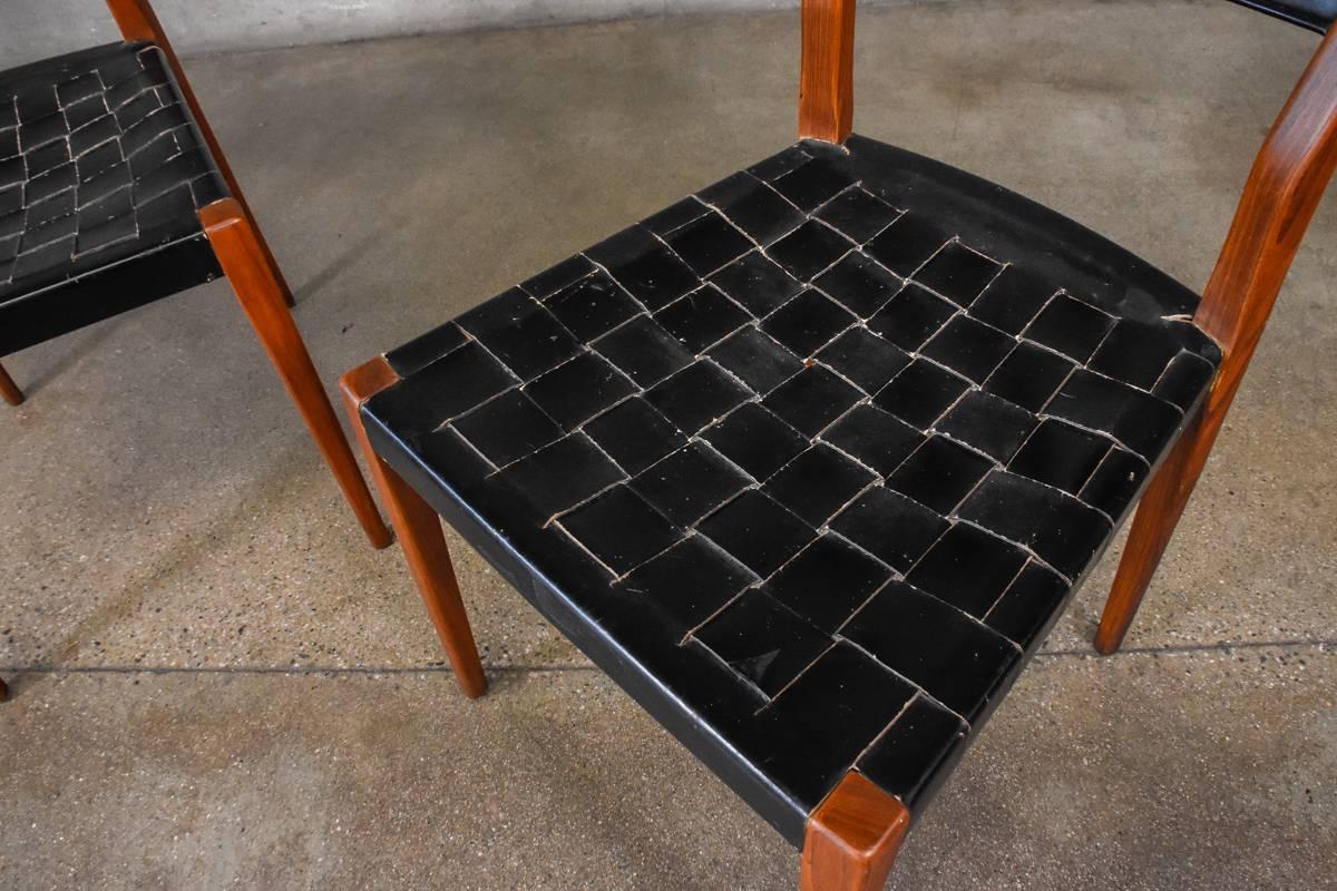 A pair of woven leather strap side chairs designed by Paul McCobb for Directional. These have a great patinated look. They do show some notable wear as pictured.

Measures: 18