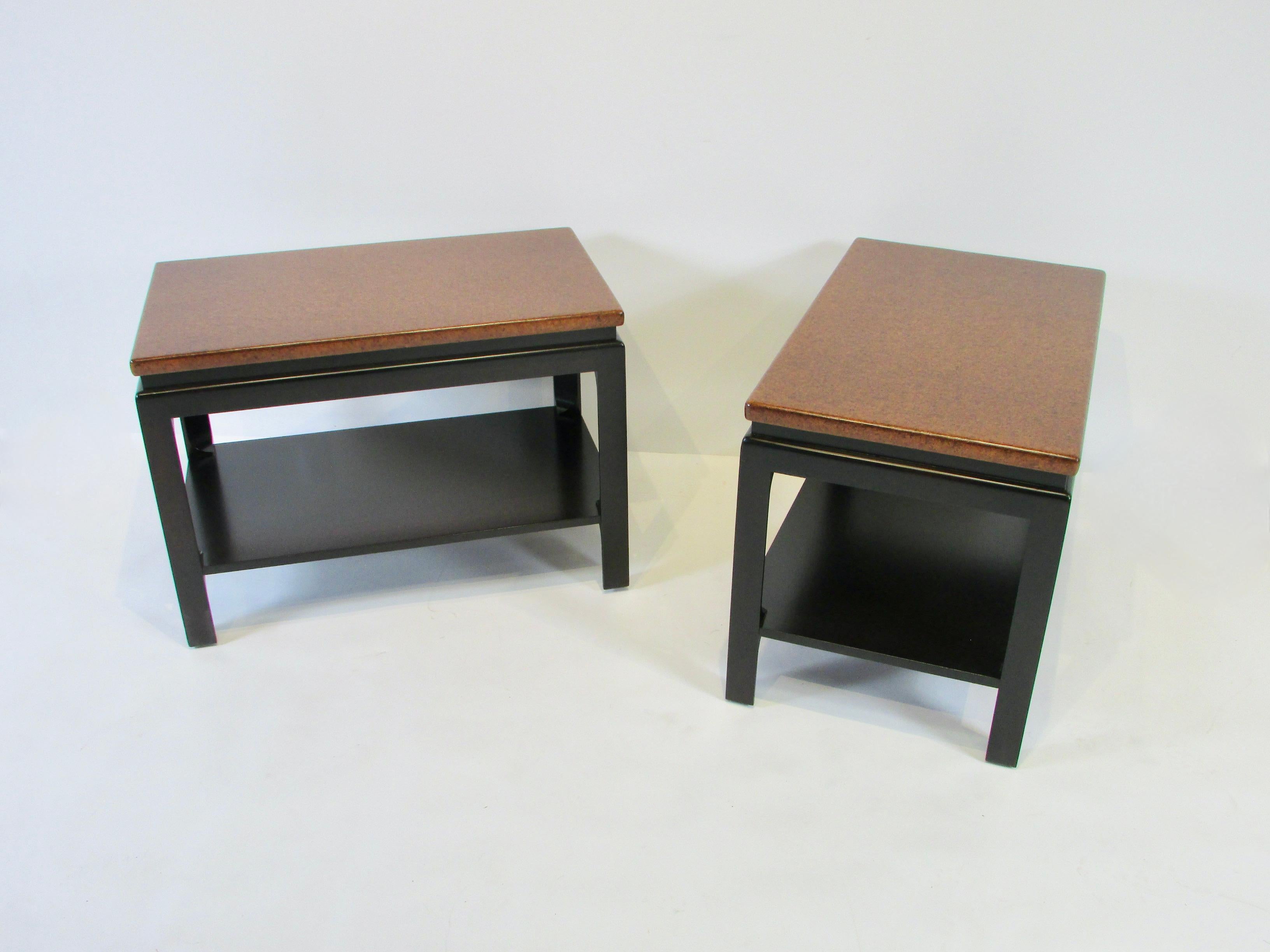Classic Paul Frankl cork top side or end tables. Dark finish base with lower tier shelf below natural tone cork tops.