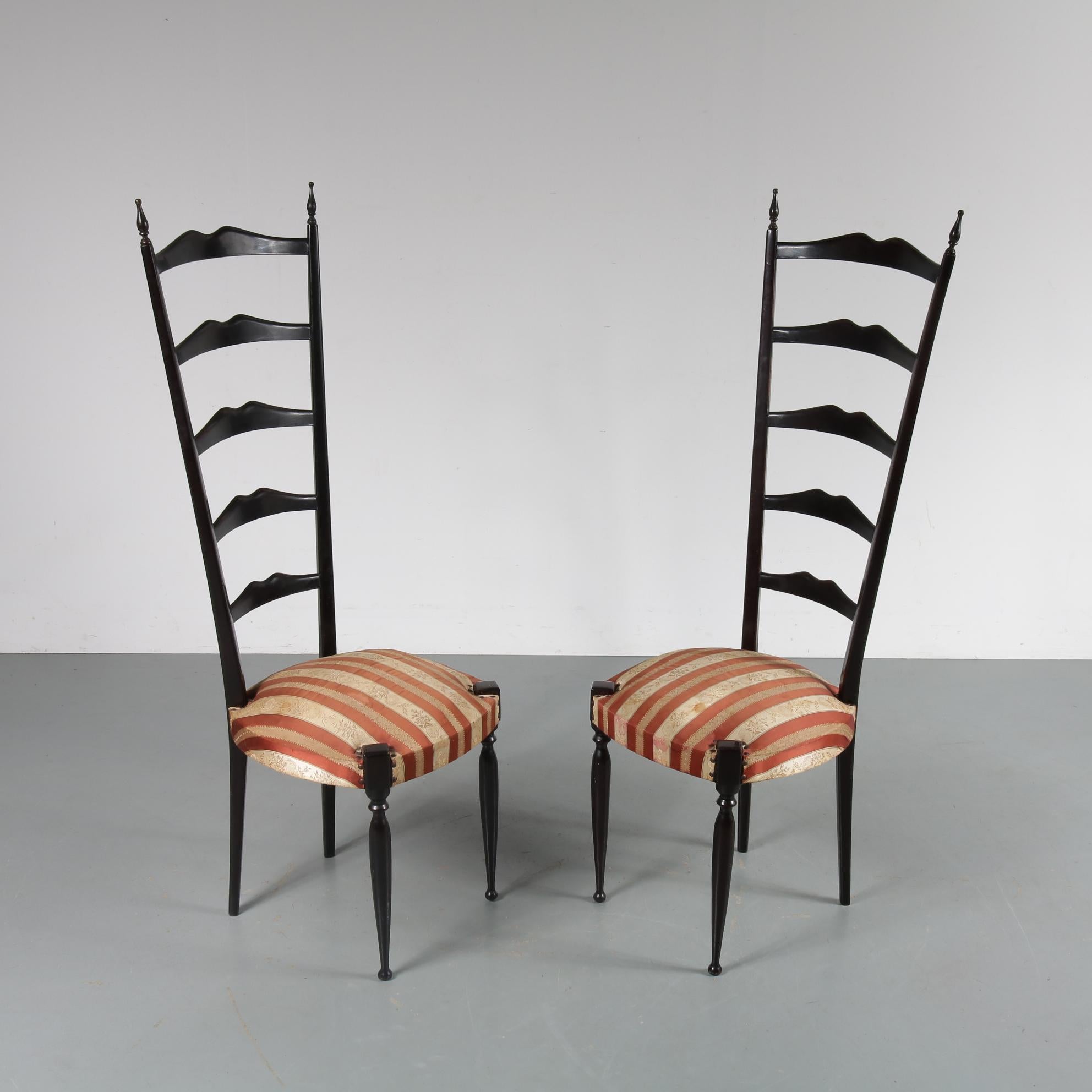 A rare pair of highback side chairs designed by Paulo Buffa and manufactured in Italy, circa 1950.

These beautiful chairs have a wonderful elegant appearance, making them iconic pieces of Italian design. They are made of high quality dark
