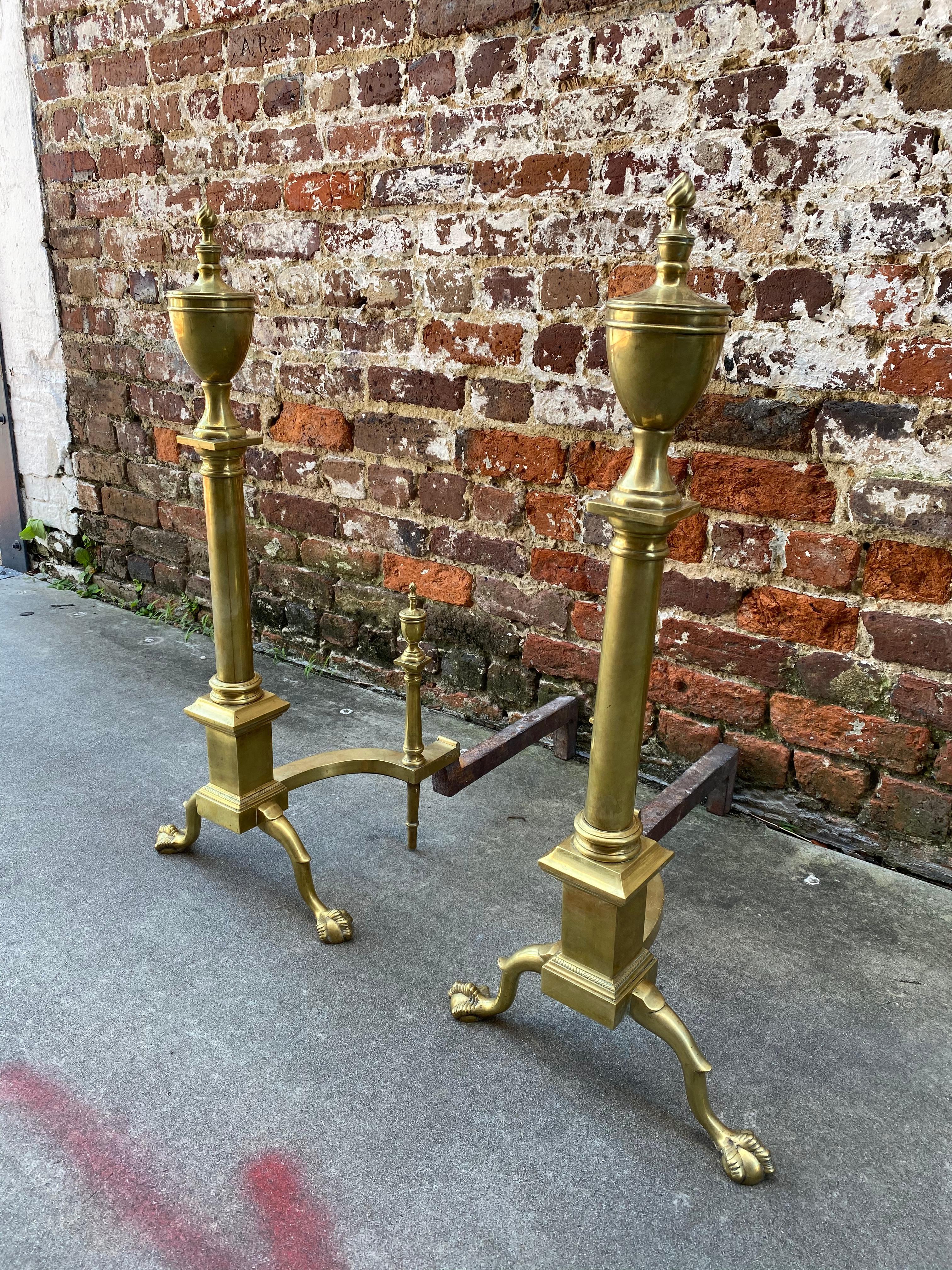 Pair of paw foot with urn top American andirons.