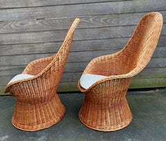 Pair of "Peacock" High Back Rattan Chairs in the style of D. Van Sliedrecht