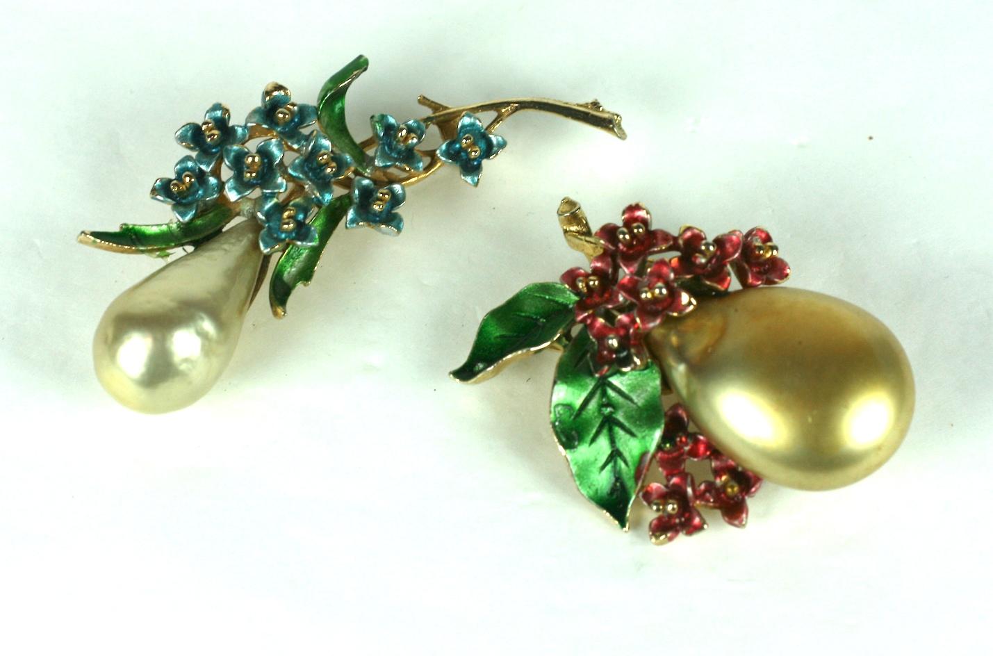 Charming Pair of Pearl Bud Brooches by Art both with large faux pear shaped pearls as the focal points within settings of blue and rasberry enameled florals. Wonderful worn together. 1950's USA. 
3