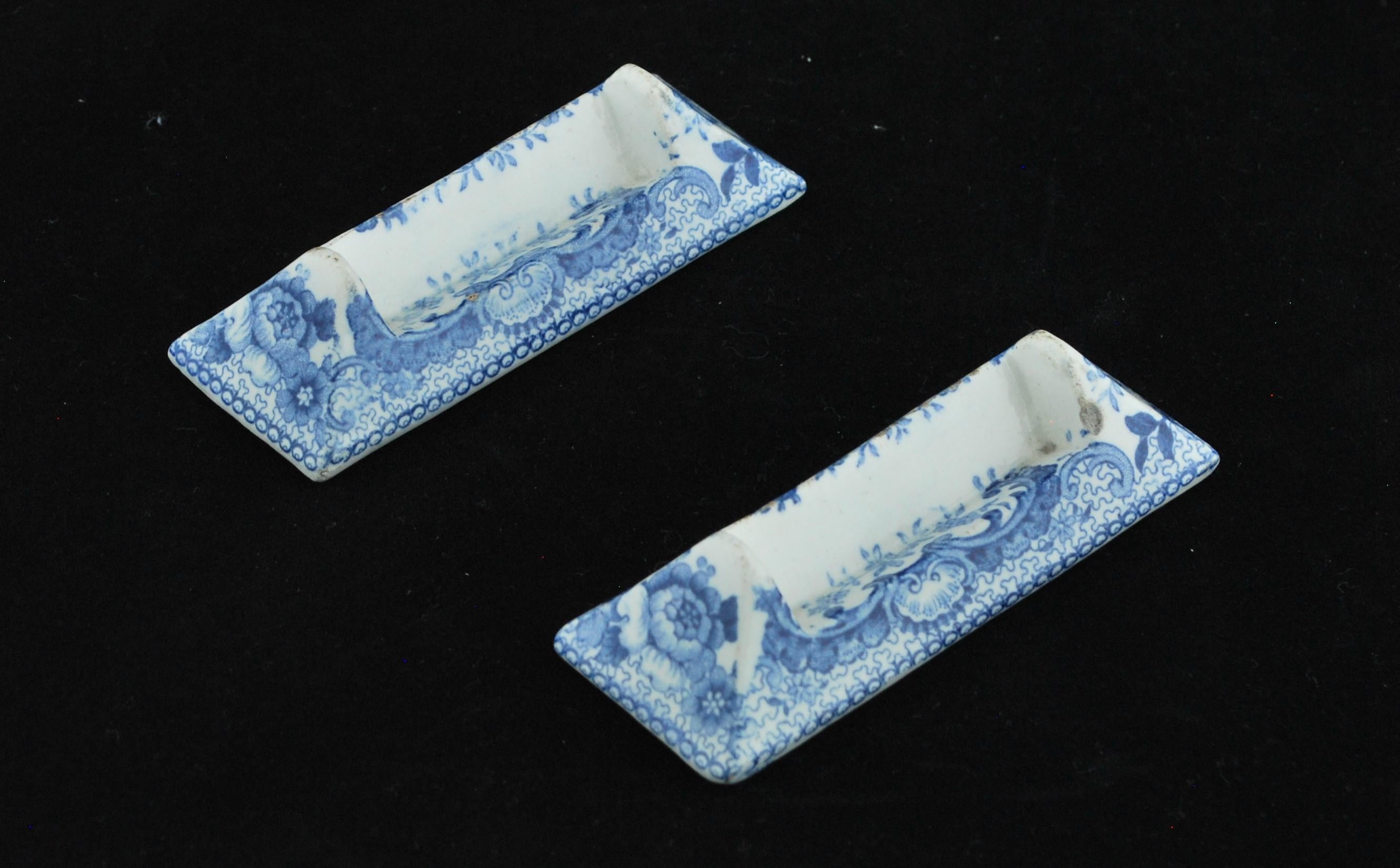 A fine pair of pearlware knife-rests with underglaze blue decoration. Possibly by Spode.