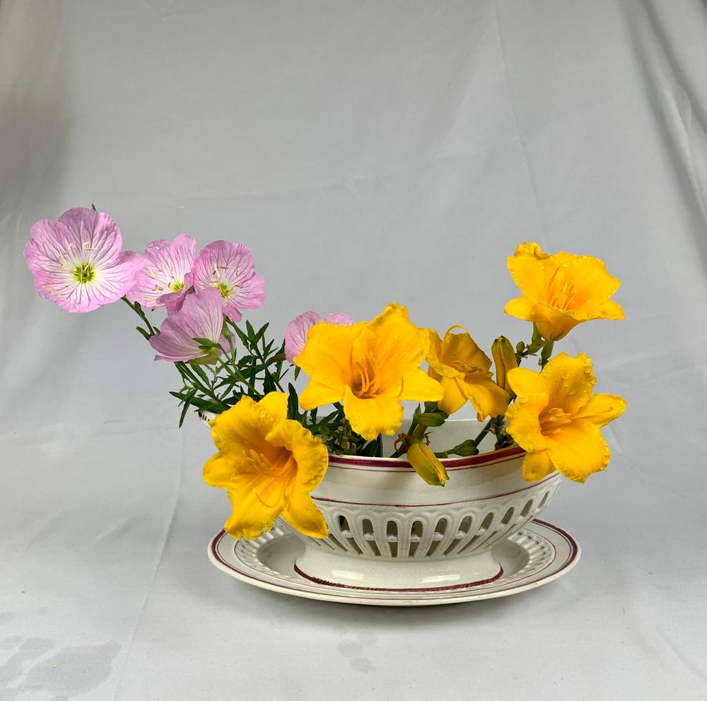 This pair of elegant oval-shaped pearlware baskets and stands were made by Thomas Fell & Co**, St Peter’s Pottery, Newcastle upon Tyne, circa 1830. The baskets were made to hold bread or baked sweets. They also look great filled with flowers (see