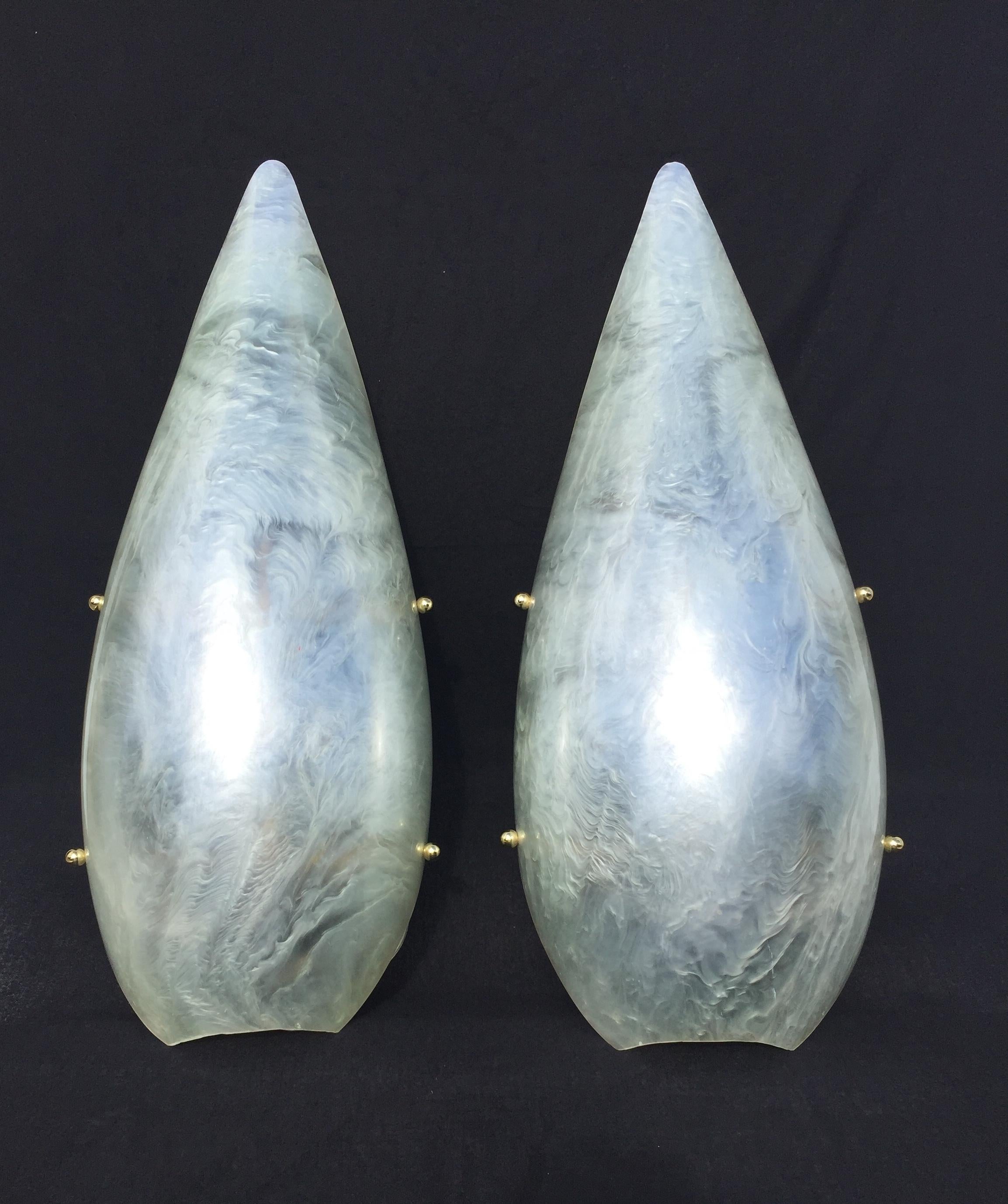 Pair of pearly white sconces in resin, great light when it’s coming through the translucid material.
The great shape, makes a perfectly elegant wall decoration and wall lights as well.
Re wired for US recently.
