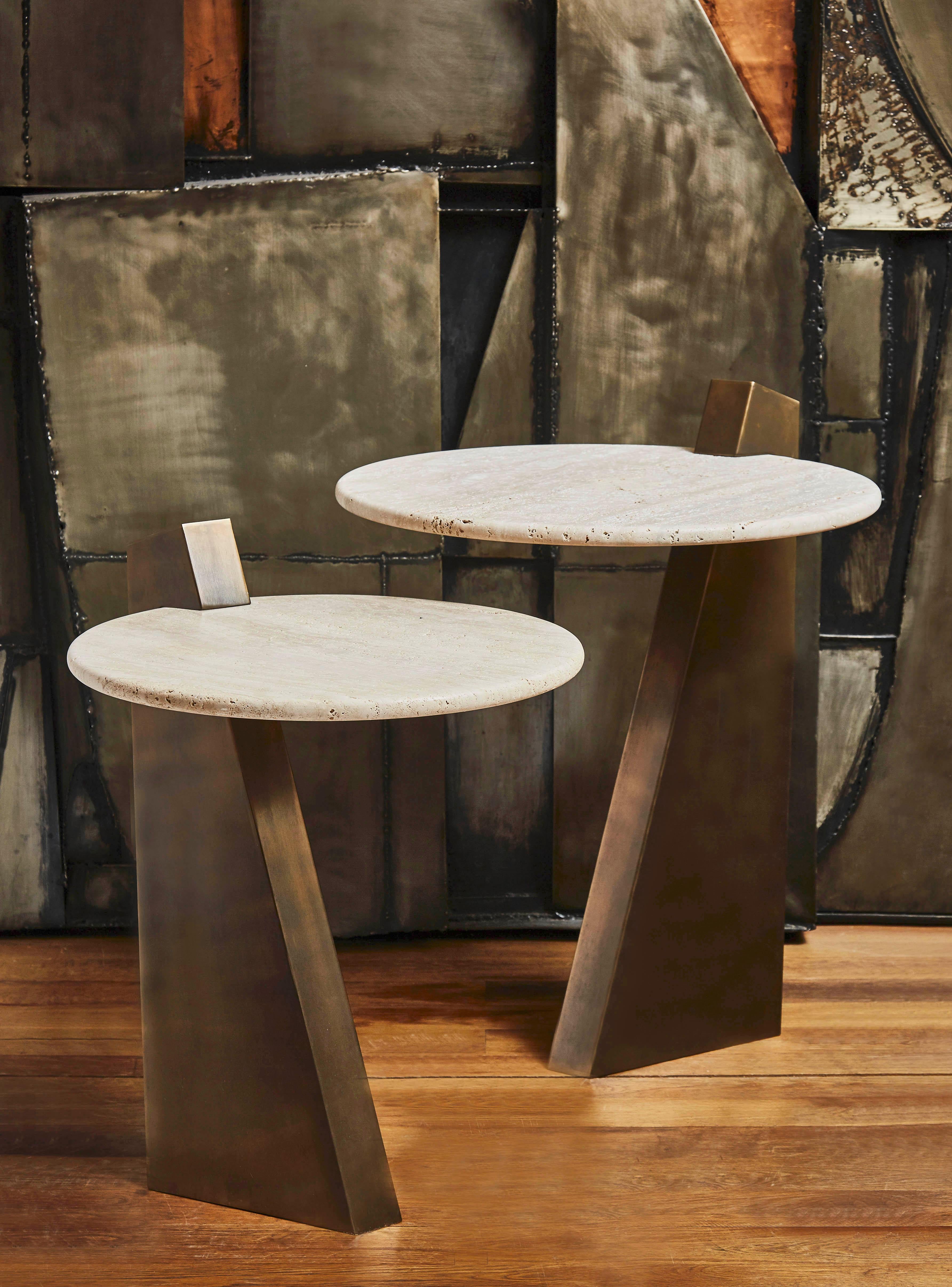 Pair of pedestal tables in patinated brass with a travertine top. Creation by Studio Glustin.
Brass finishes and stone top customizable.
(Can be sold separately)
Measures: Diameter 55 x height 61 cm
Diameter 45 x height 53 cm.