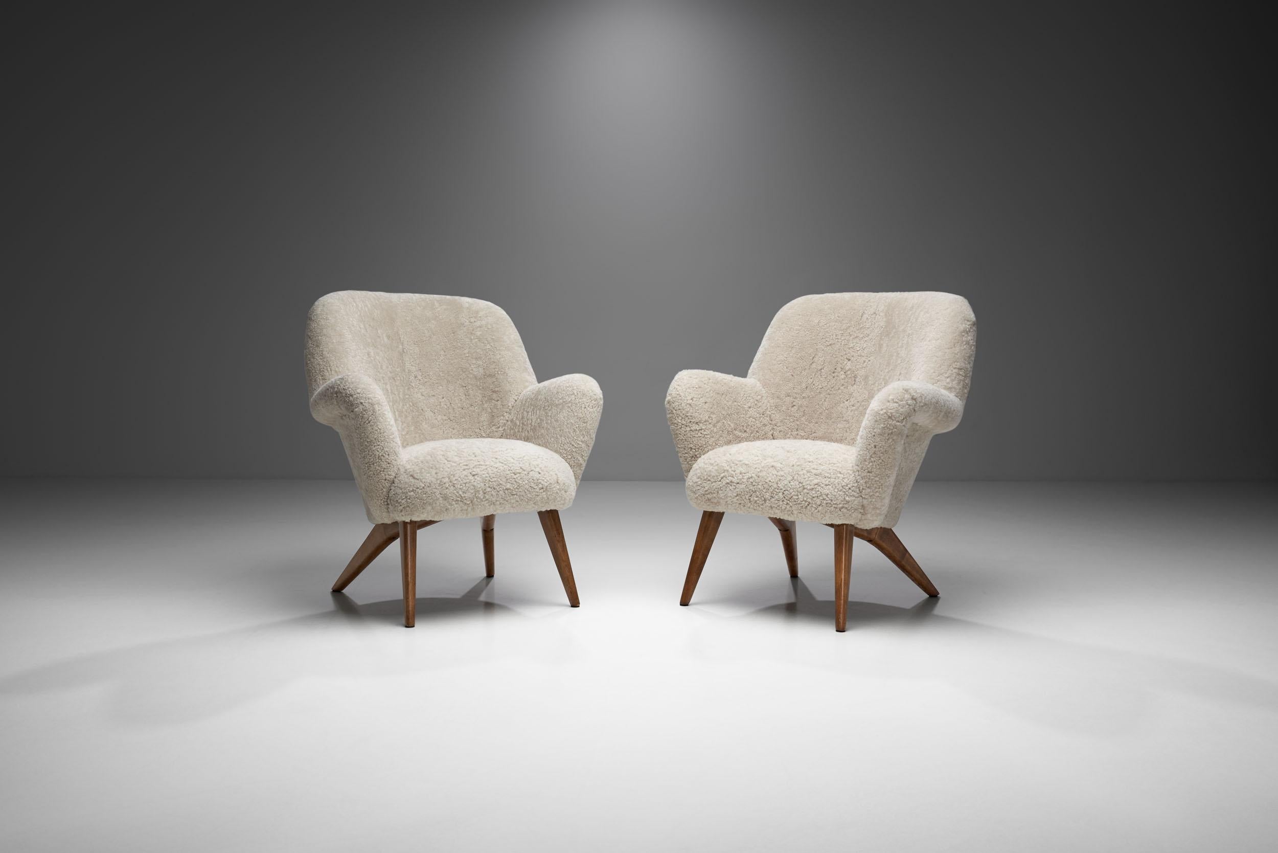 These “Pedro” armchairs show the homely curviness that defined the design of the 1950s. Hiort af Ornäs developed this model for his own furniture company, Puunveisto Oy.

The Pedro model has a soft, sculptural shape paired with an ergonomic