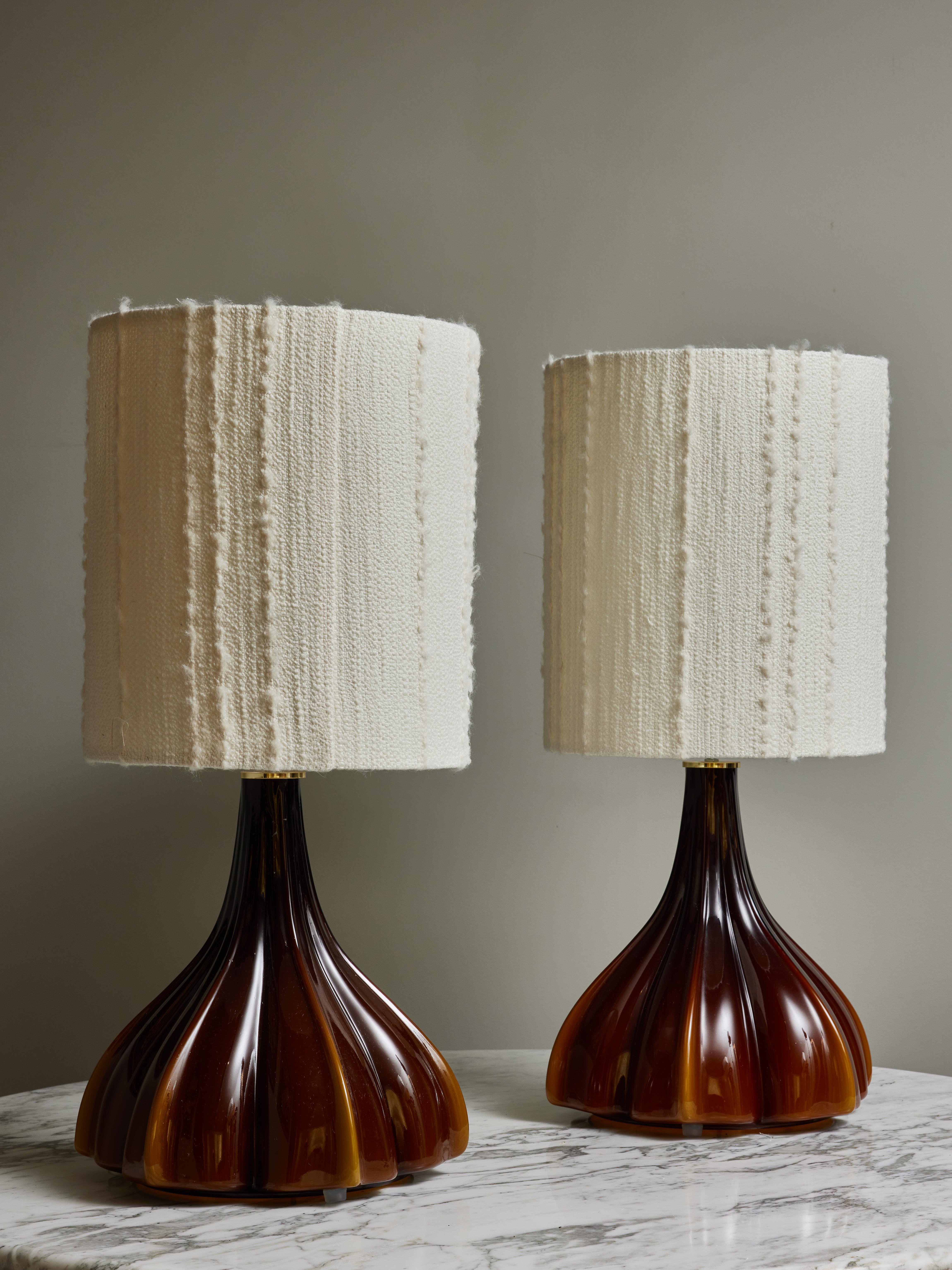 Pair of glass table lamps made by Peill & Putzler in the 1970s.

These are made of a single molded glass flower shaped piece, tinted in brown with lighter beige hues. One source of light under the shade and one inside the glass.

Peill & Putzler