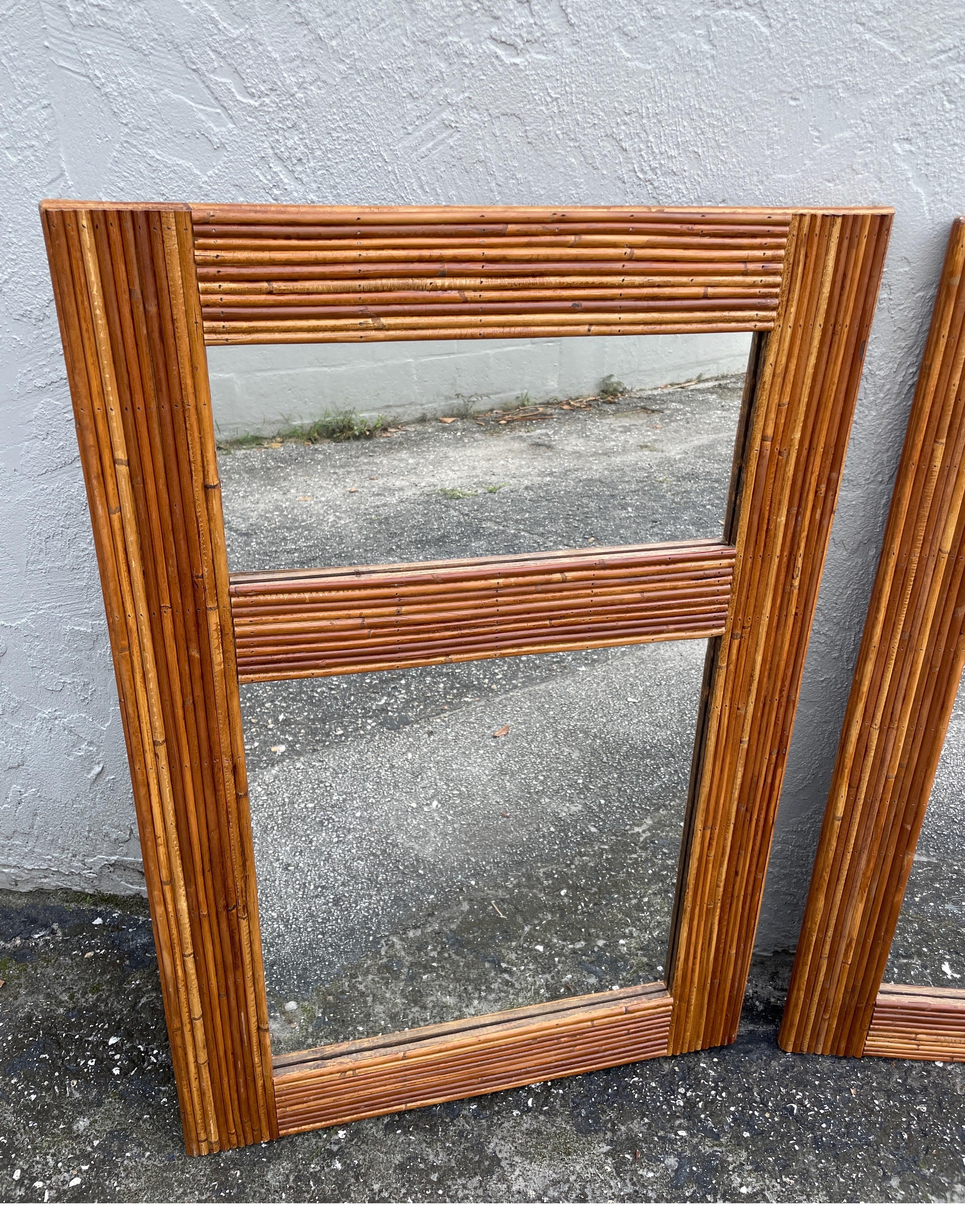 Pair of pencil reed bamboo wall mirrors. A very unique pair in excellent condition.