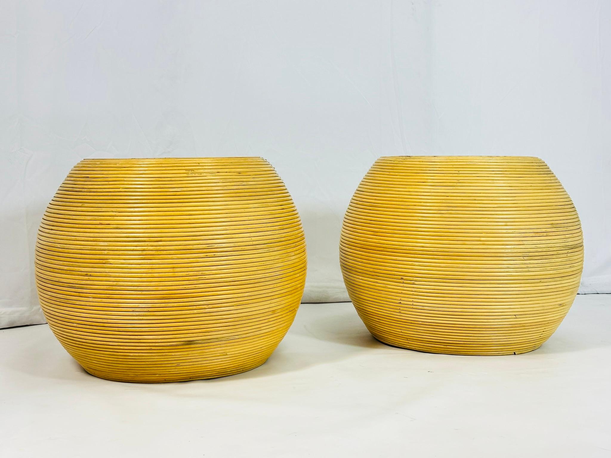 Enhance your living space with this exquisite Pair of Pencil Reed & Glass Side Tables.
Crafted with meticulous attention to detail, these tables feature elegant pencil reed frames that exude sophistication and style. 
The glass tops provide a sleek